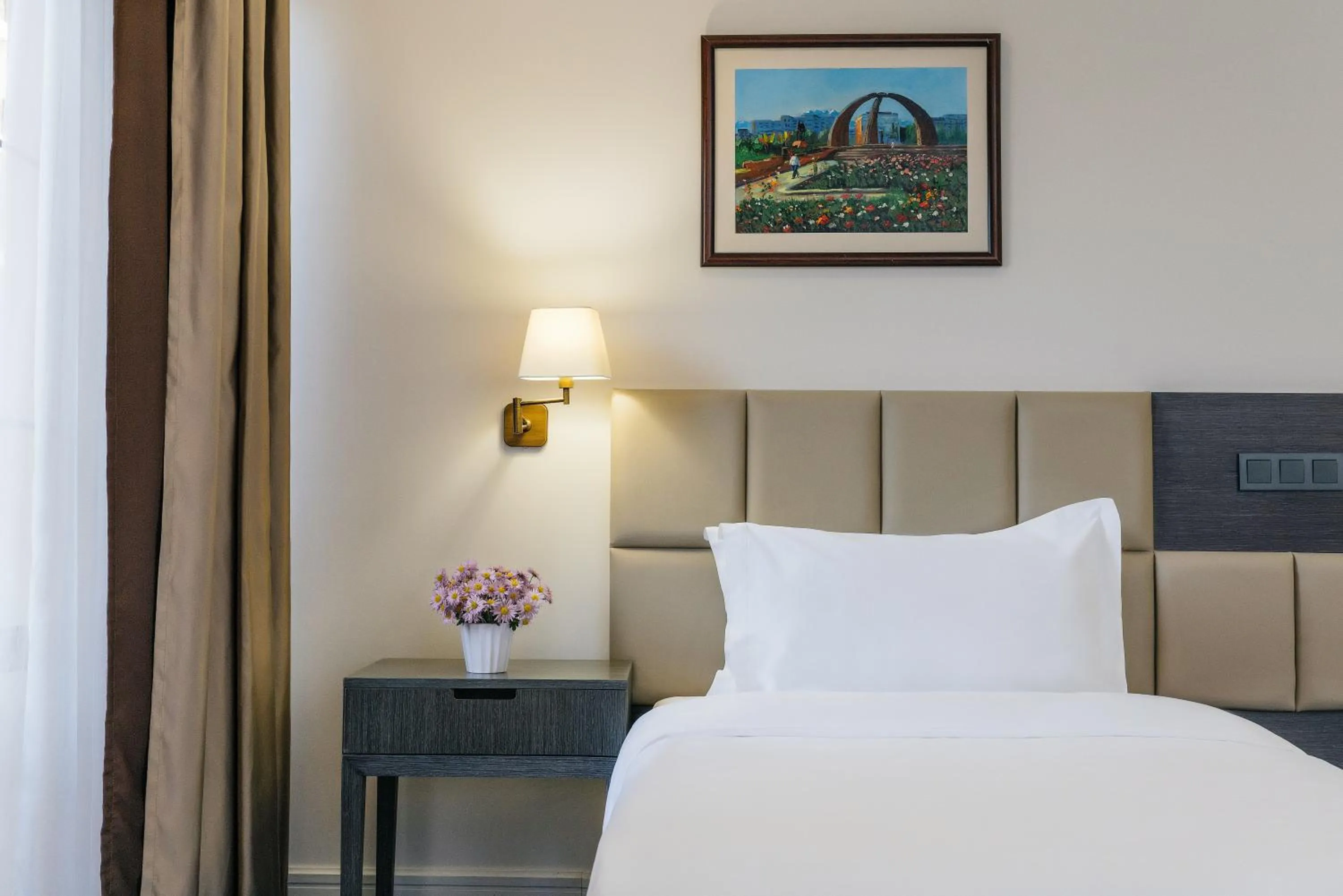 Bed in Ambassador Hotel