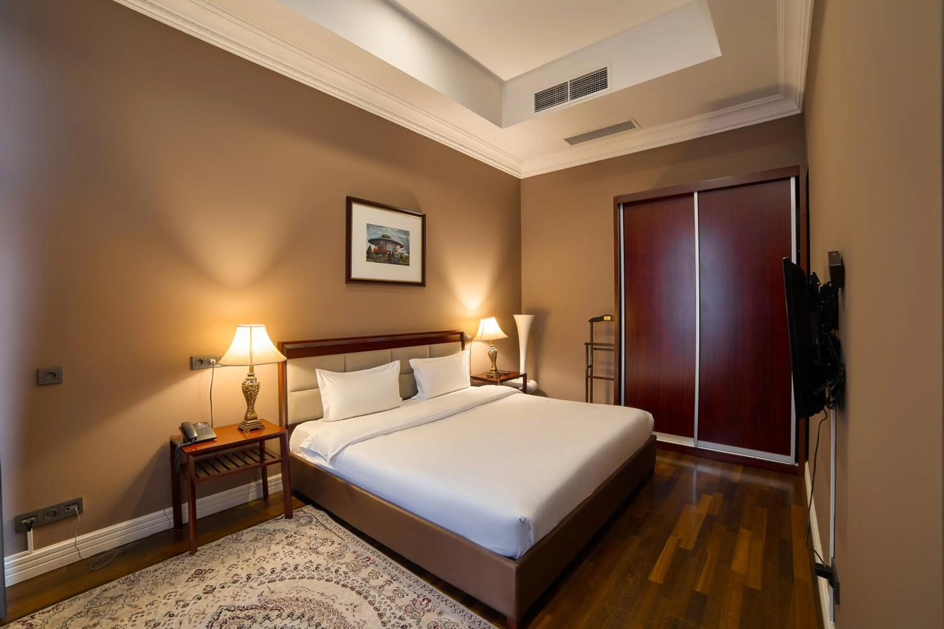 Bed in Ambassador Hotel