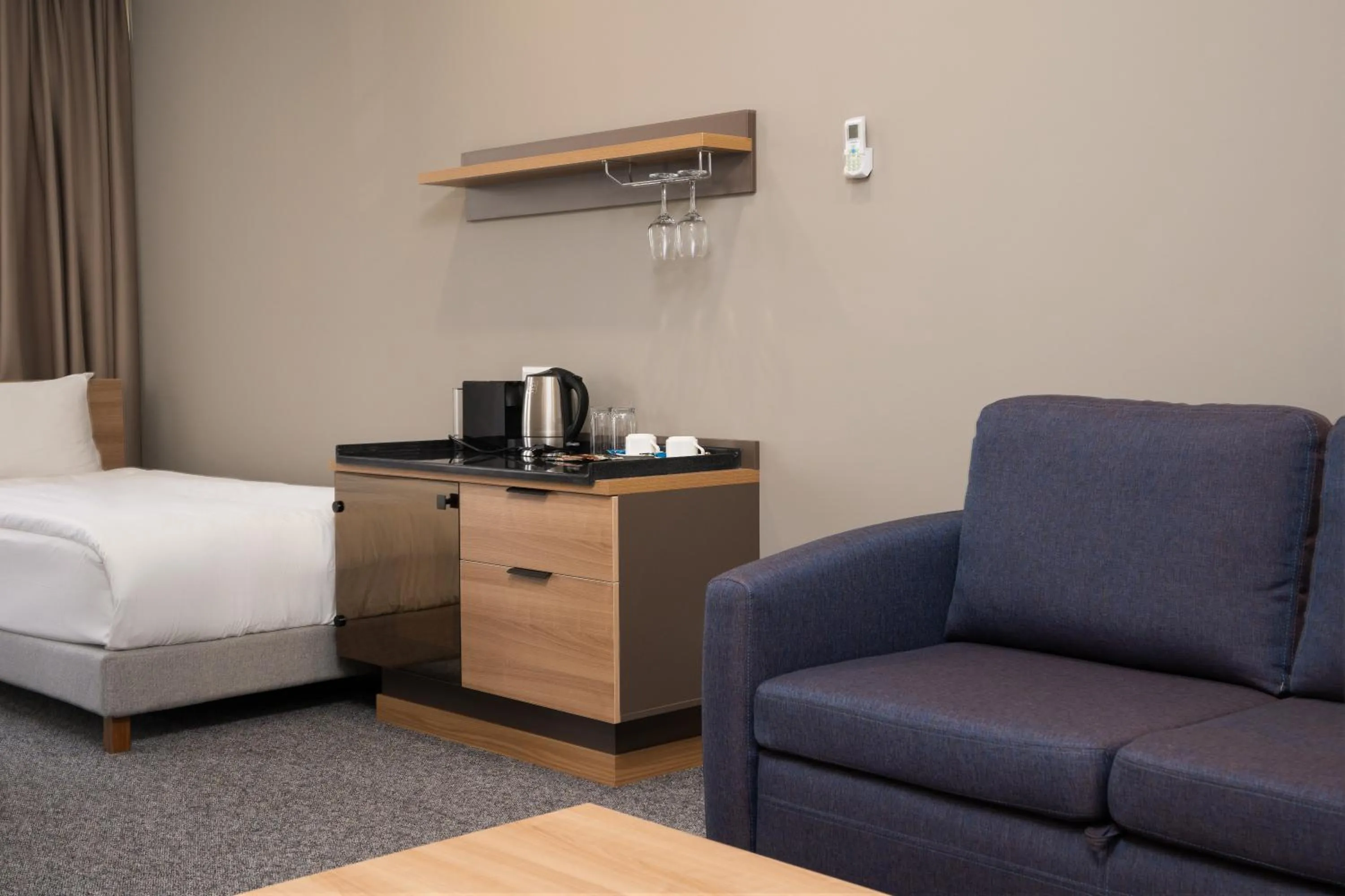 Seating area, Bed in Ambassador Hotel