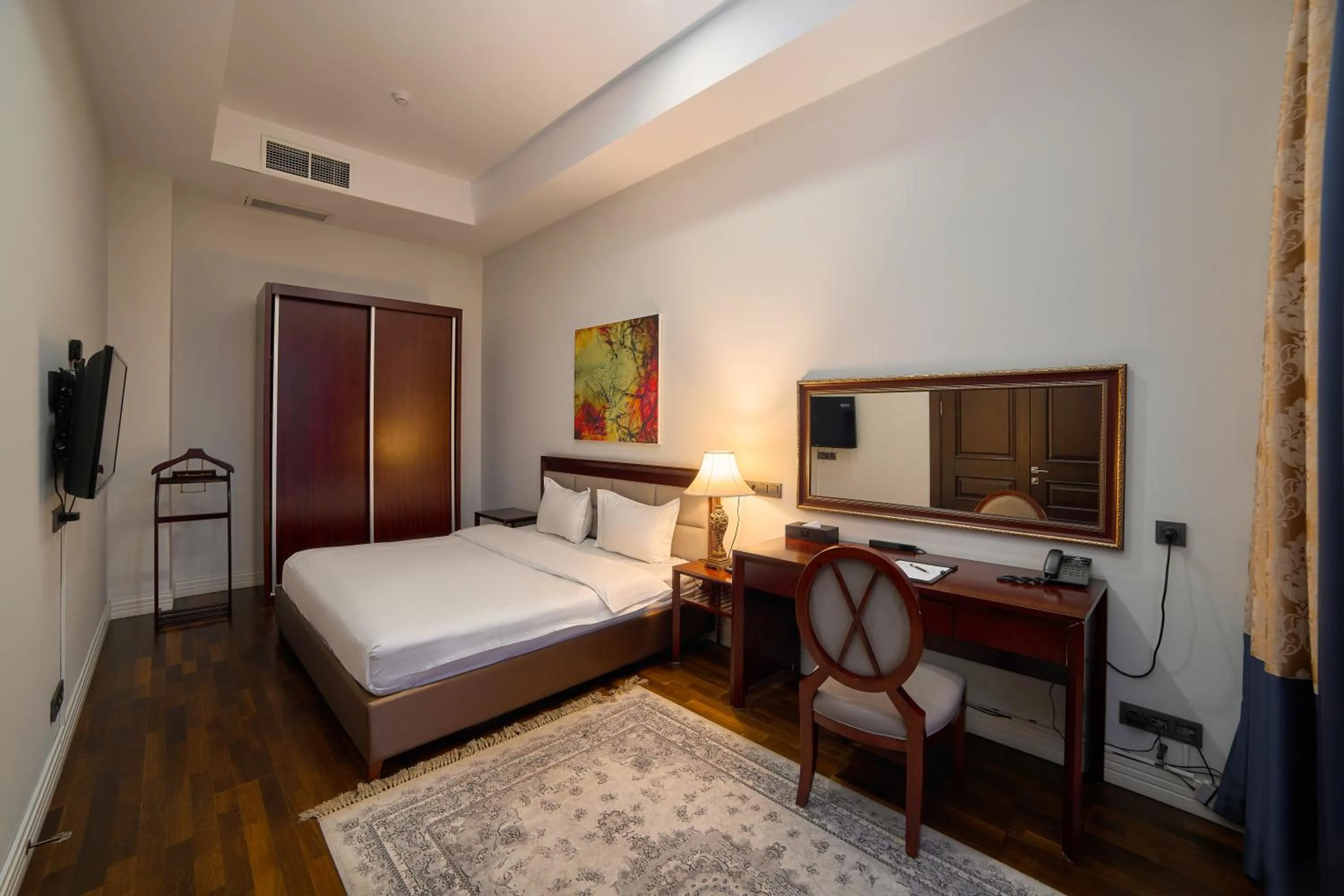 Bed in Ambassador Hotel