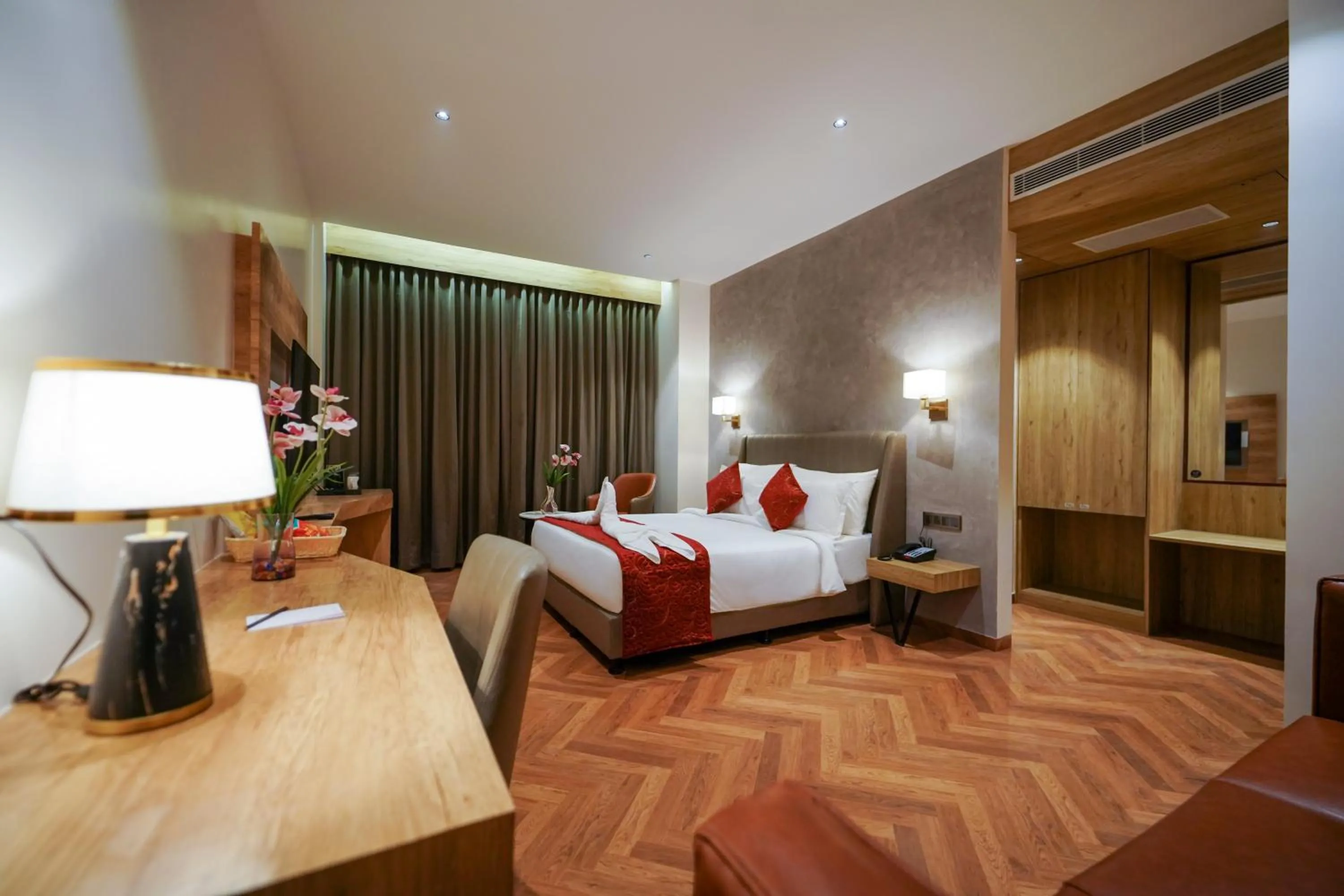 Photo of the whole room, Bed in Hotel Park Inn Nellore - Near the Hospital & Highway