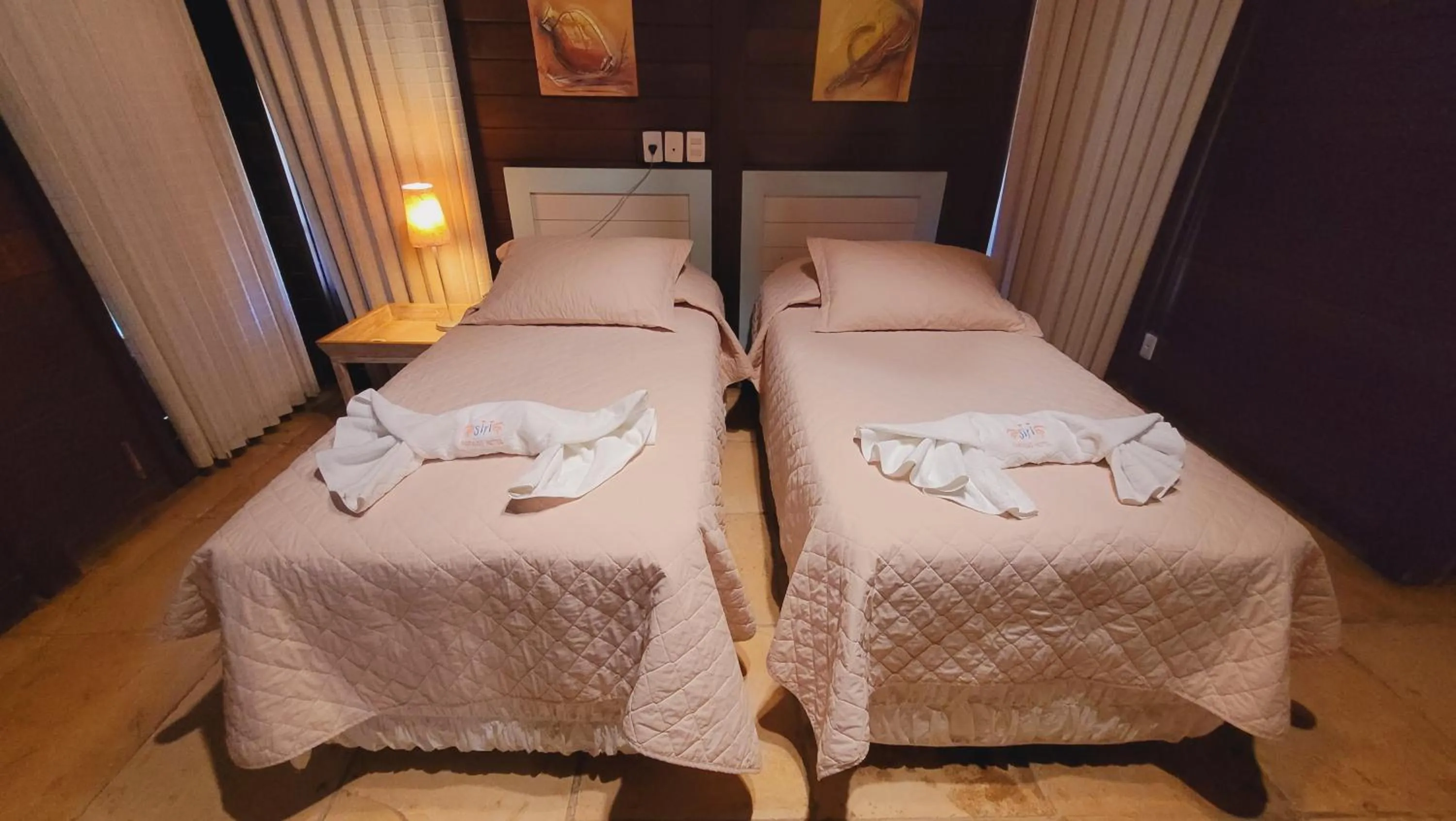 Bed in Siri Paraiso Hotel