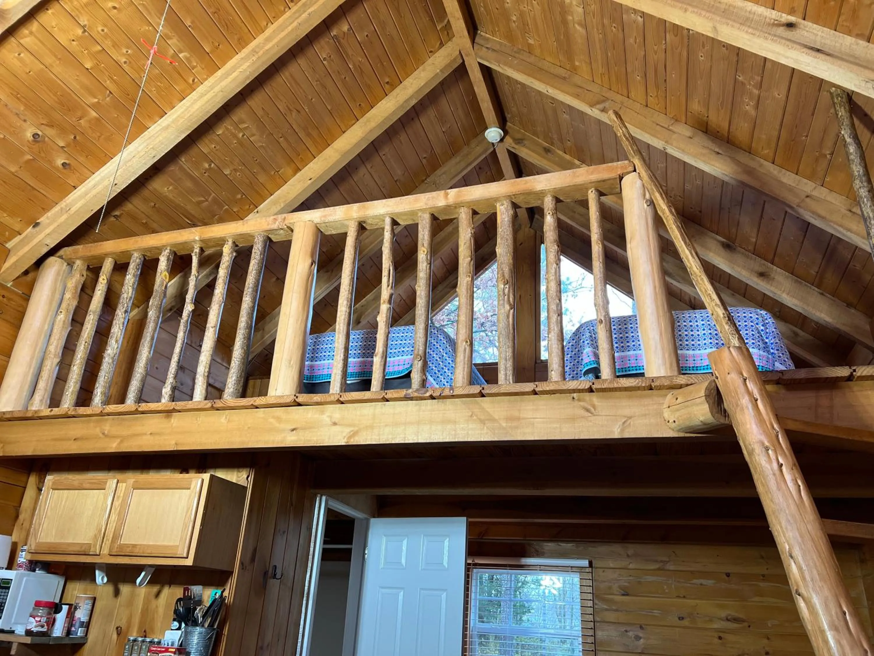 Bed in Kozy Haven Log Cabin Rentals