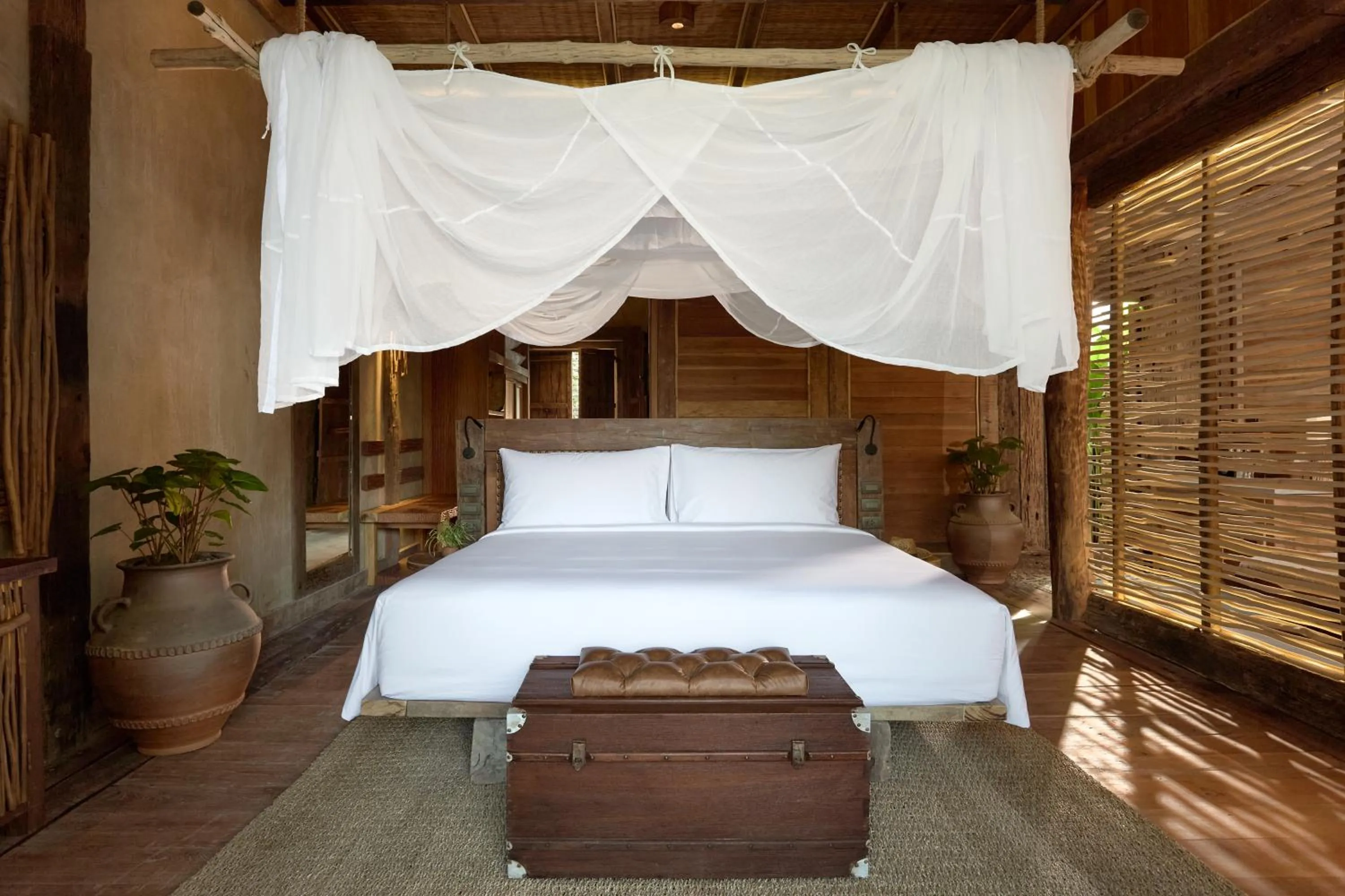 Bed in Vignette Collection Dinso Resort & Villas Ko Chang by IHG