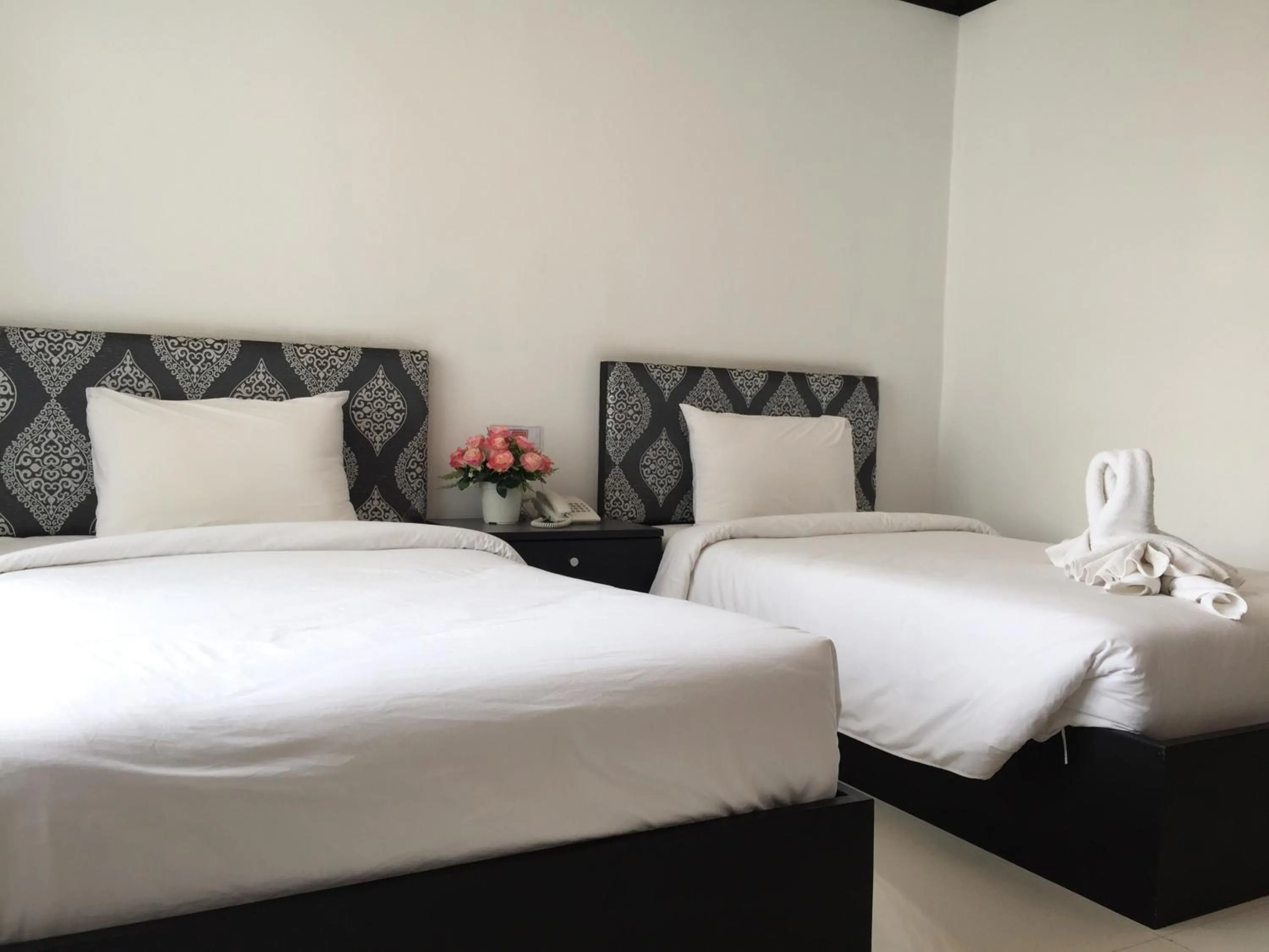 Bed in Leelawadee Grand Hotel