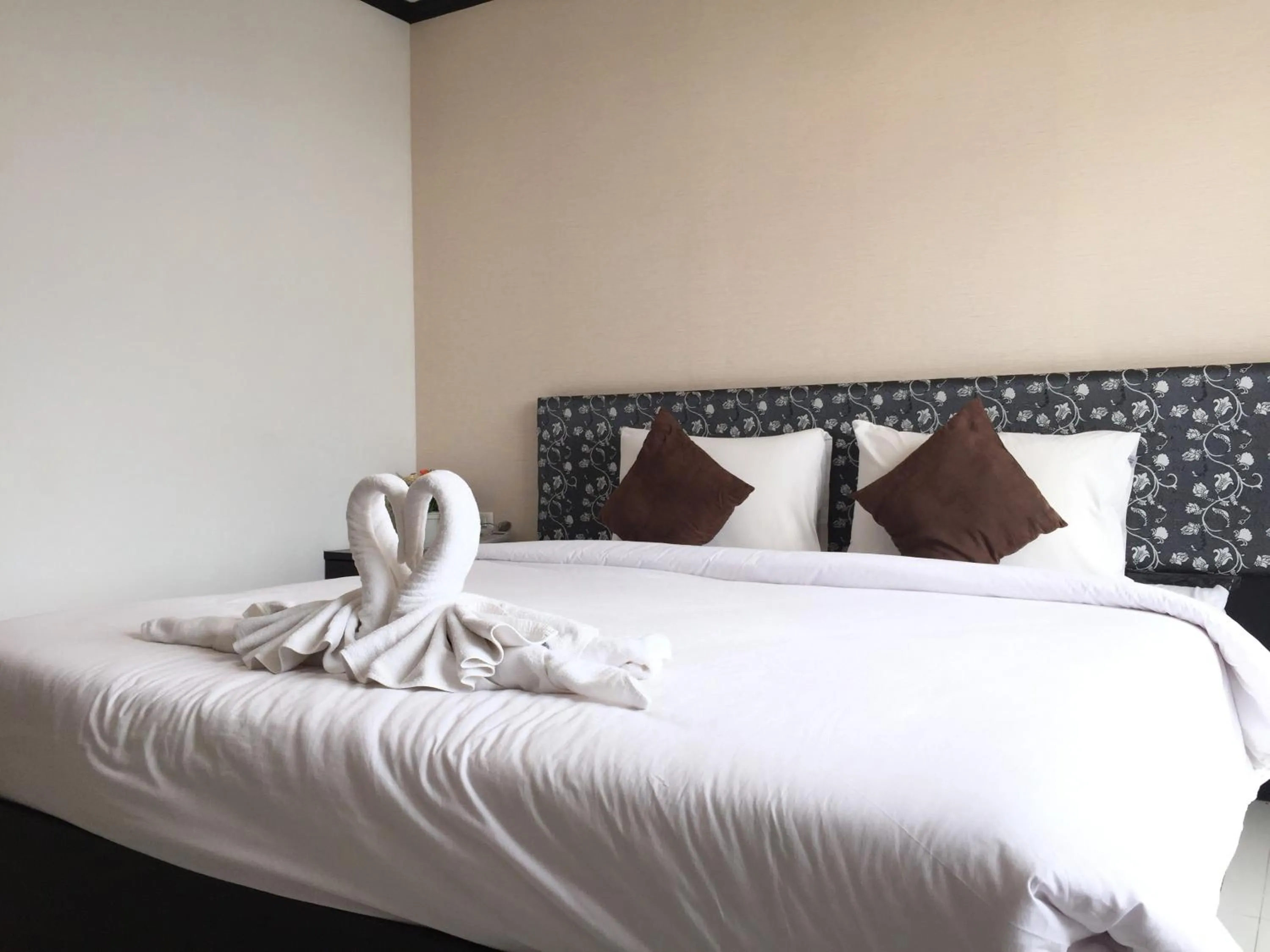 Bed in Leelawadee Grand Hotel