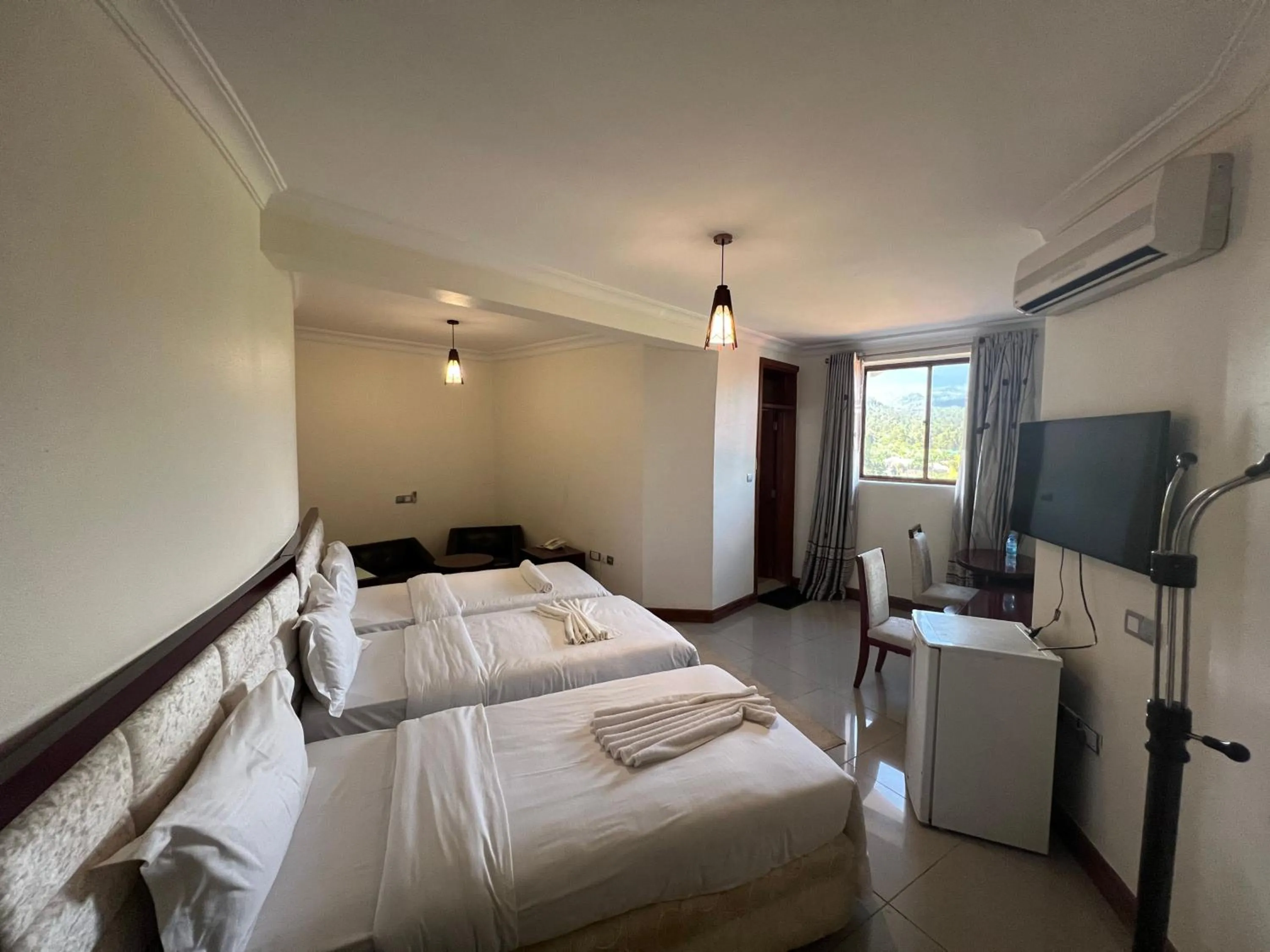 Communal lounge/ TV room in Nejobugg Palace Hotel