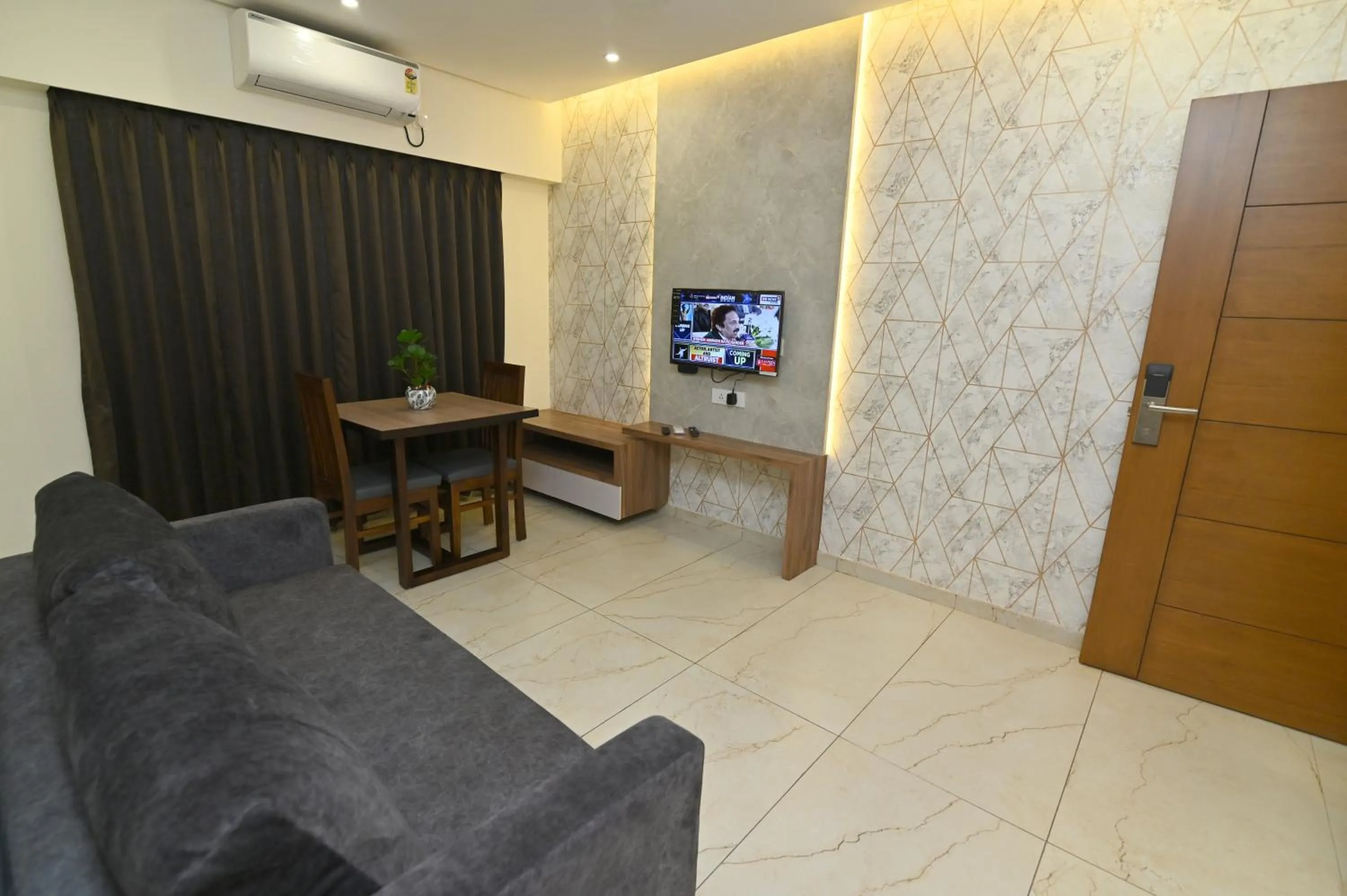 Living room in Aurelia Comforts - Deralakatte