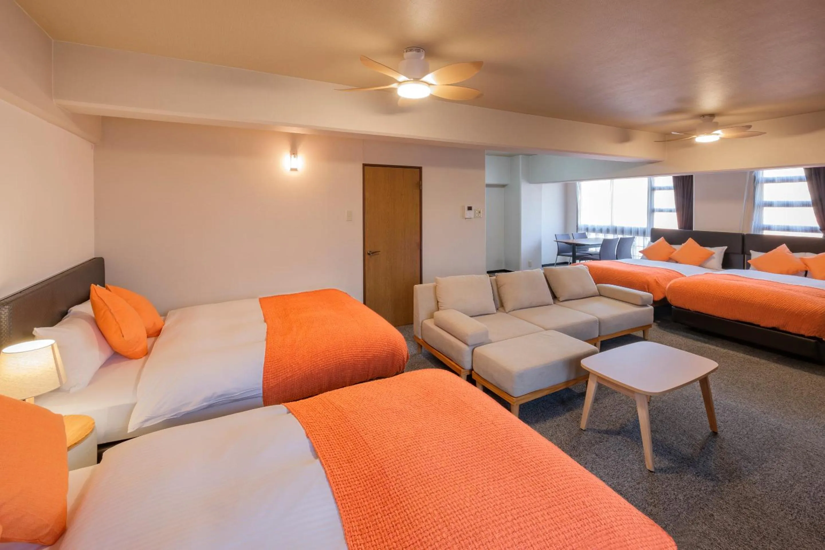 Living room, Bed in Miyazaki Mango Hotel