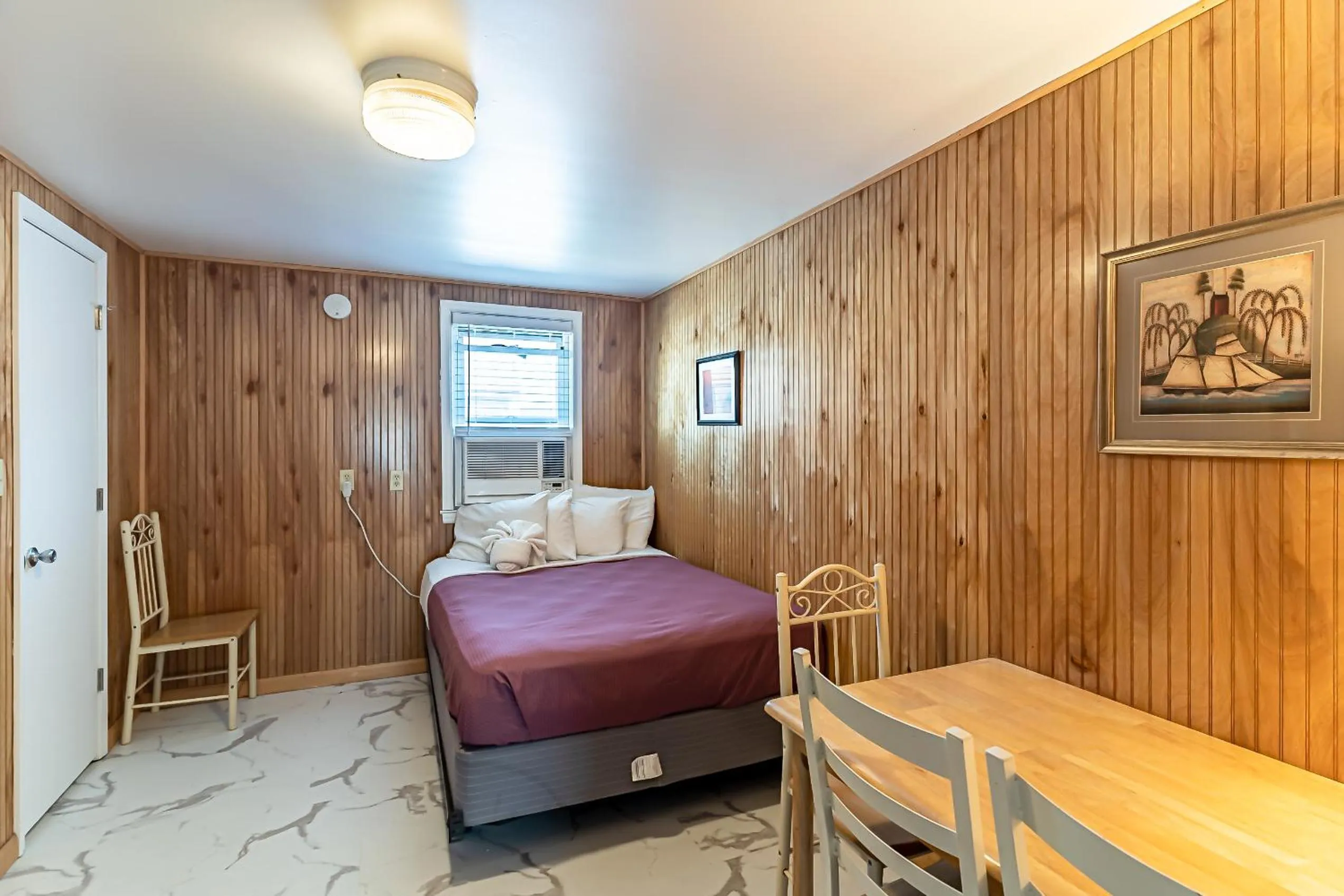 Bed in Boardwalk Sand & Surf Beach Hotel Oceanfront