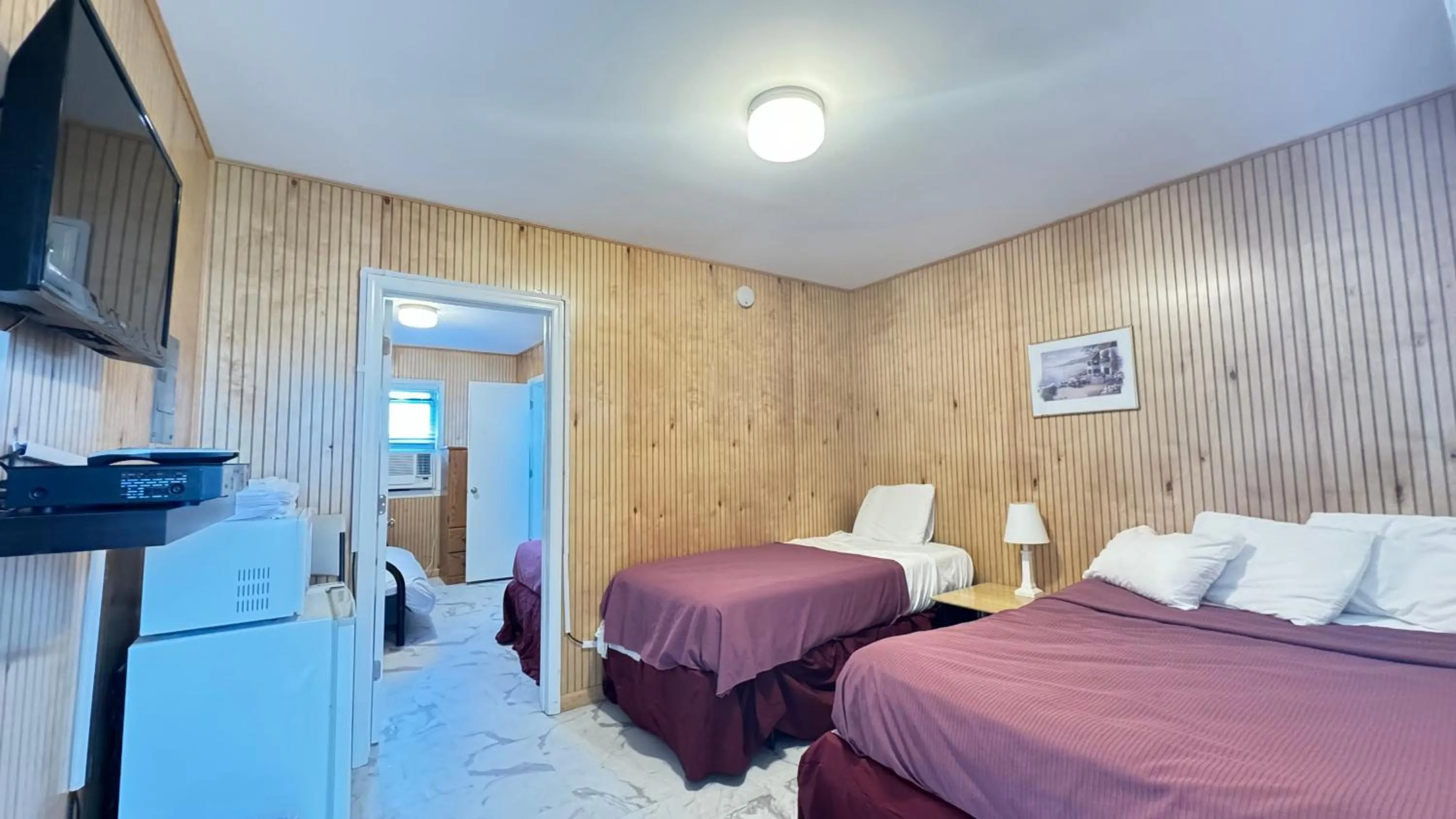 Bed in Boardwalk Sand & Surf Beach Hotel Oceanfront