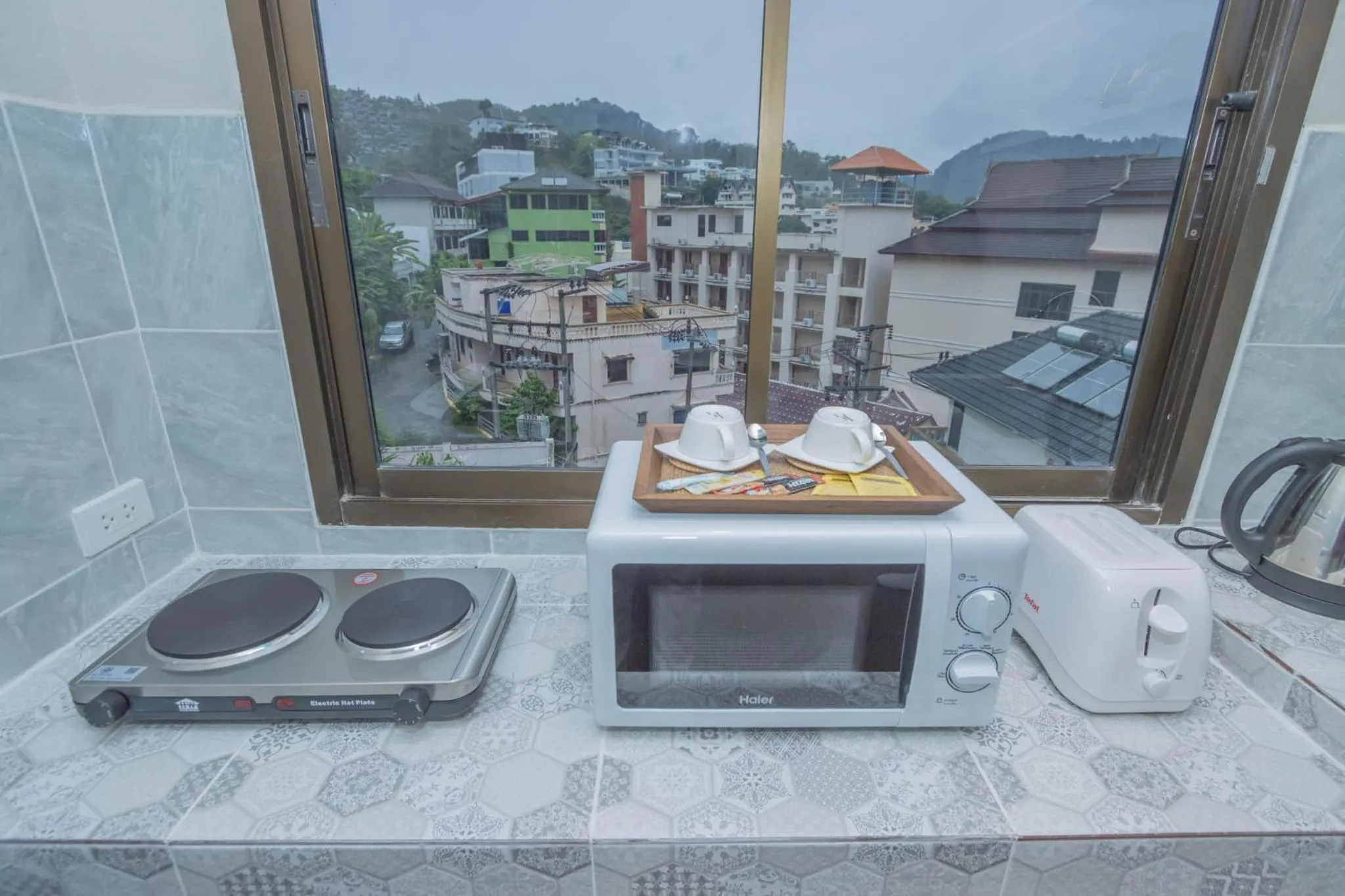 Kitchen or kitchenette in RoomQuest The Peak Patong Hill