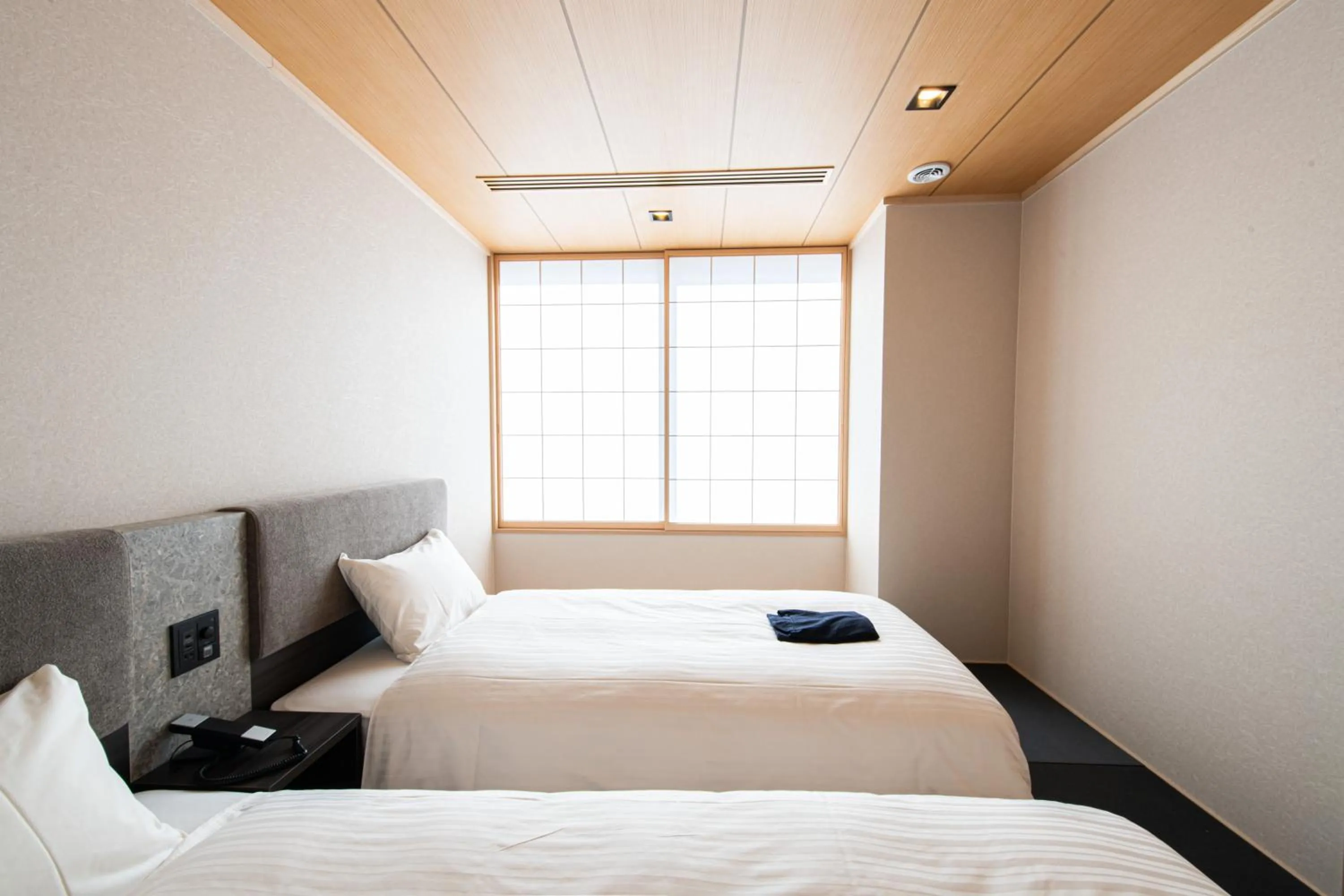 Bed in Welina Hotel Premier Osaka Namba