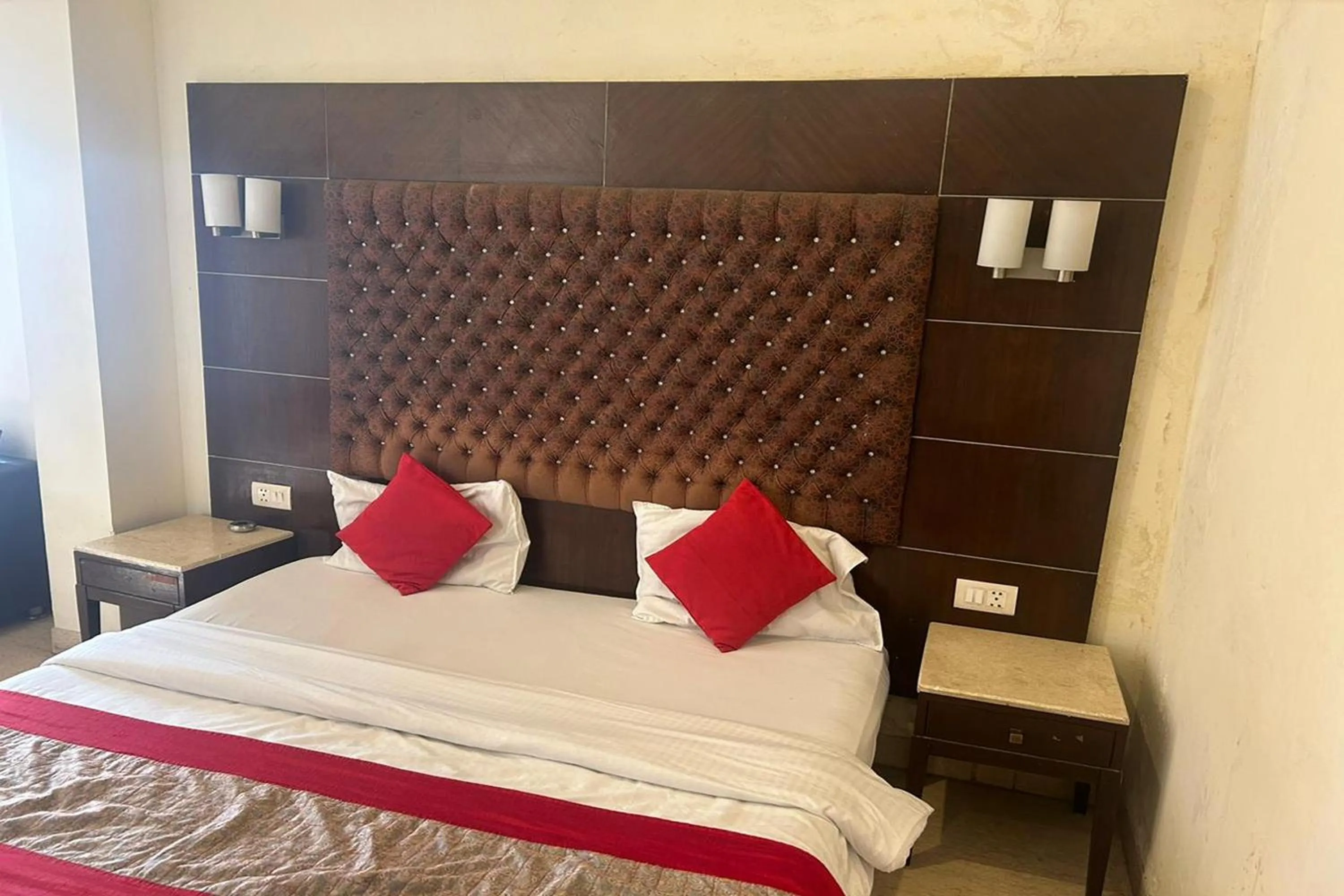 Photo of the whole room, Bed in The Metropolis Guest House Near RK Ashram Metro Station