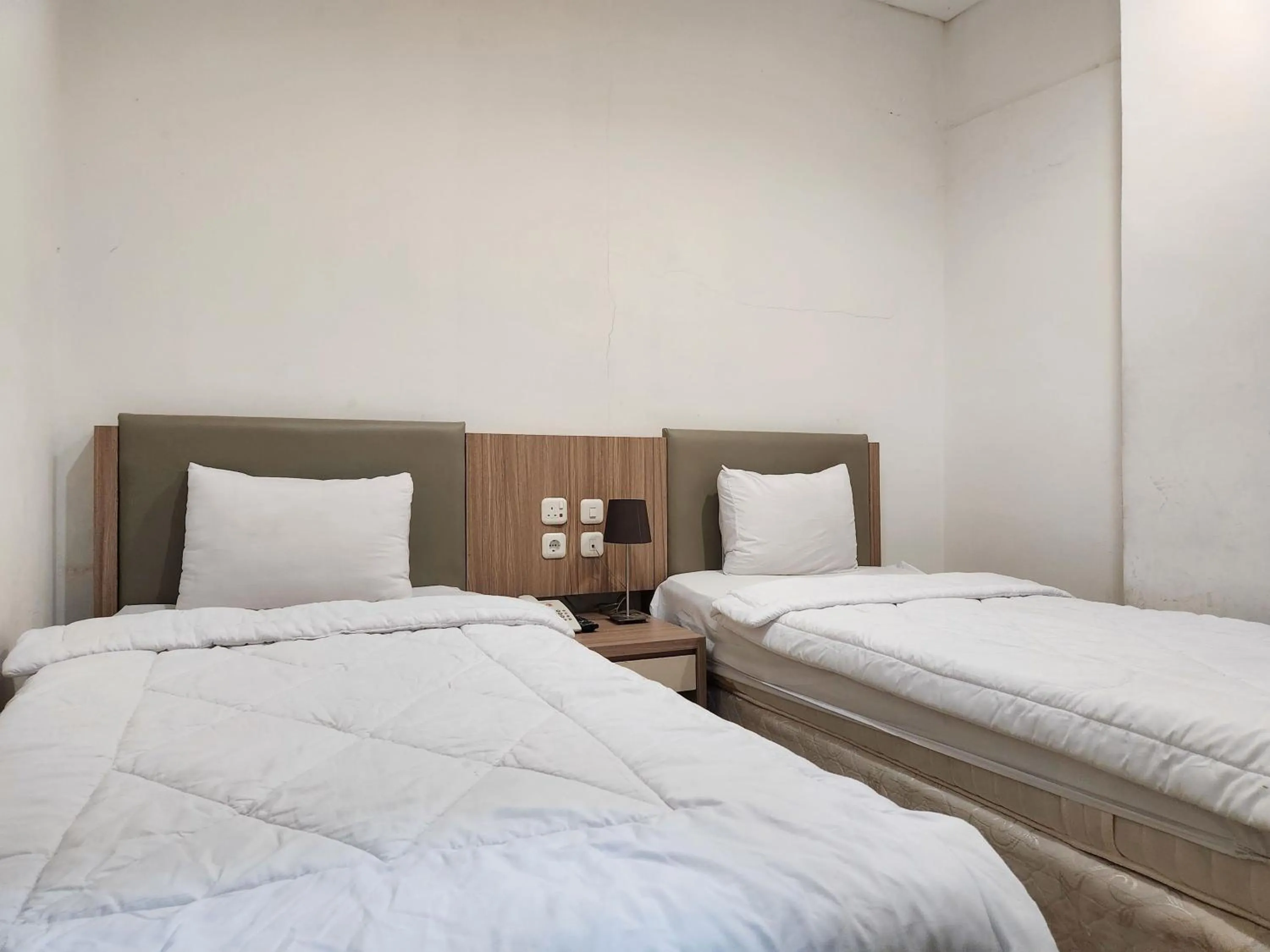 Bed in Joker Hotel & Residence