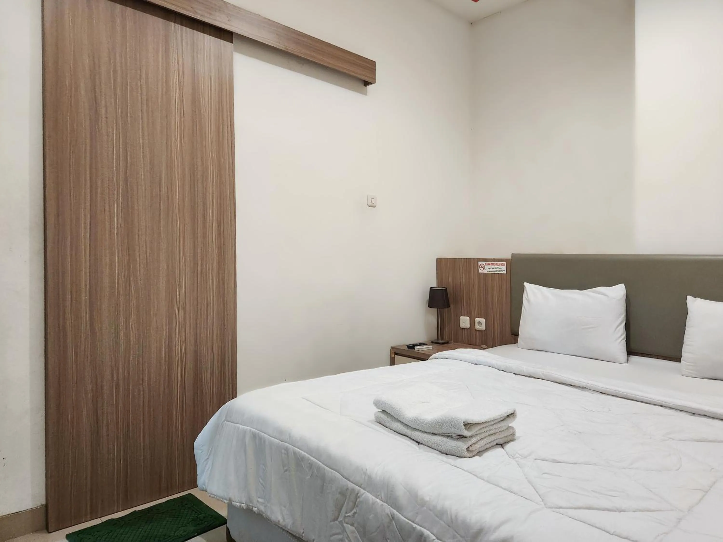 Bed in Joker Hotel & Residence