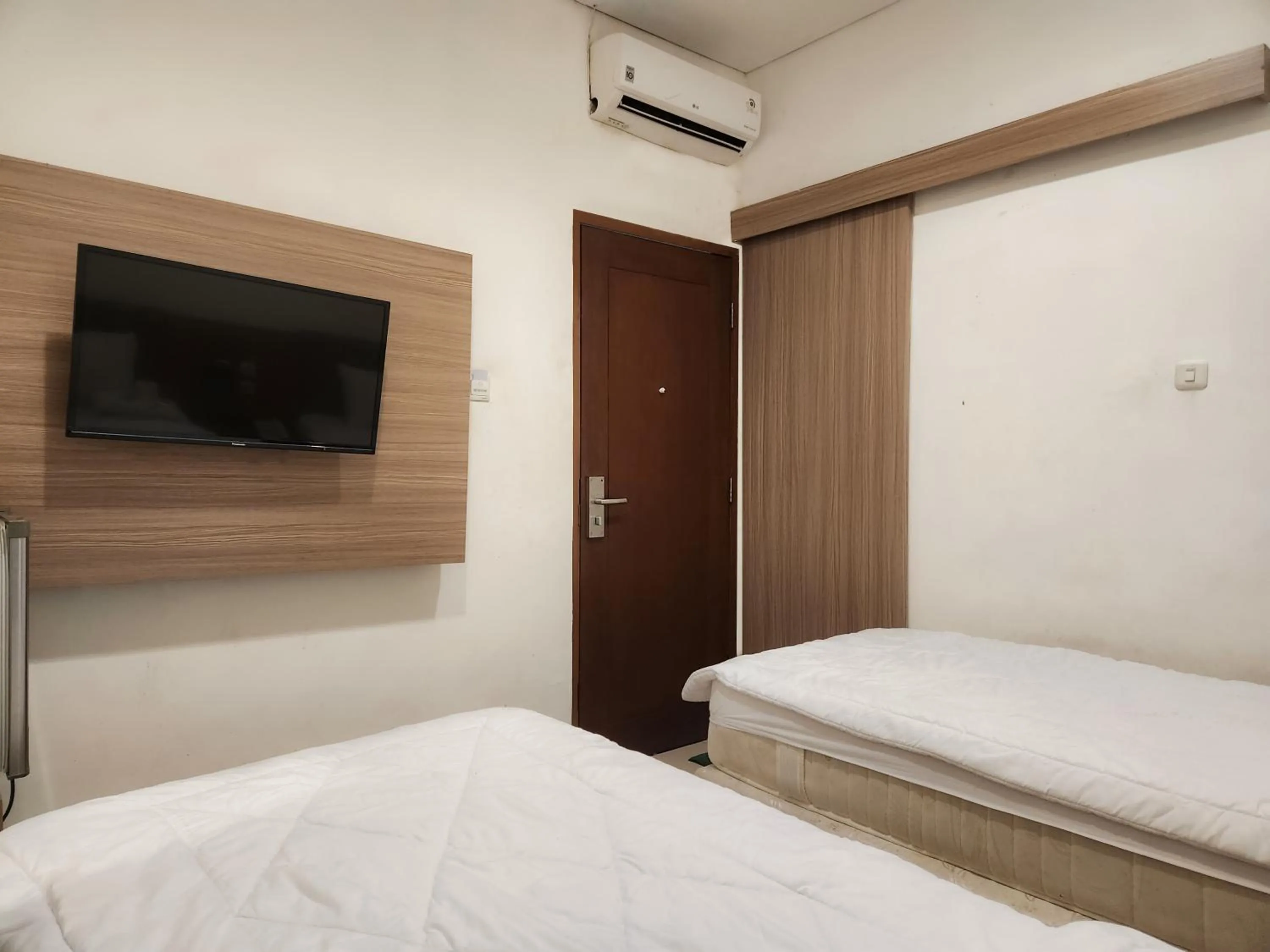Bed in Joker Hotel & Residence