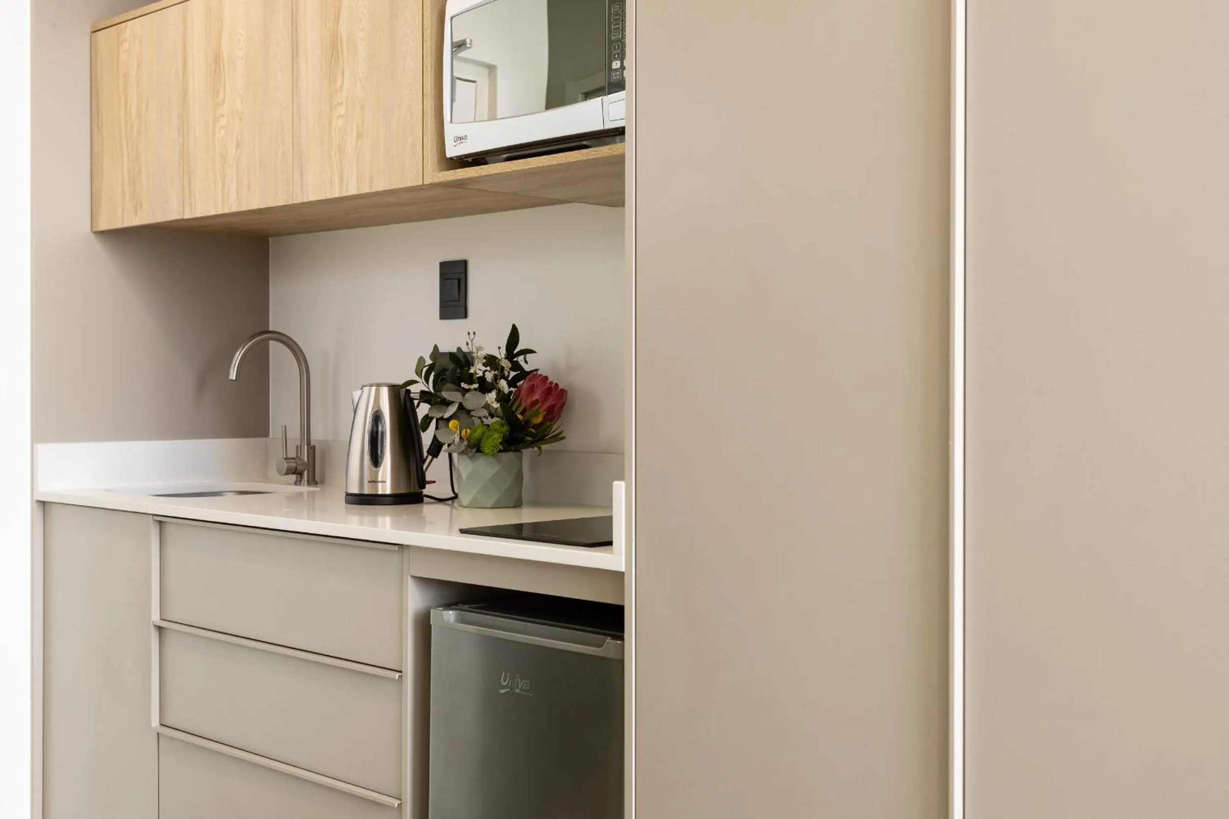 Kitchen or kitchenette in Habitat Aparthotel by Totalstay