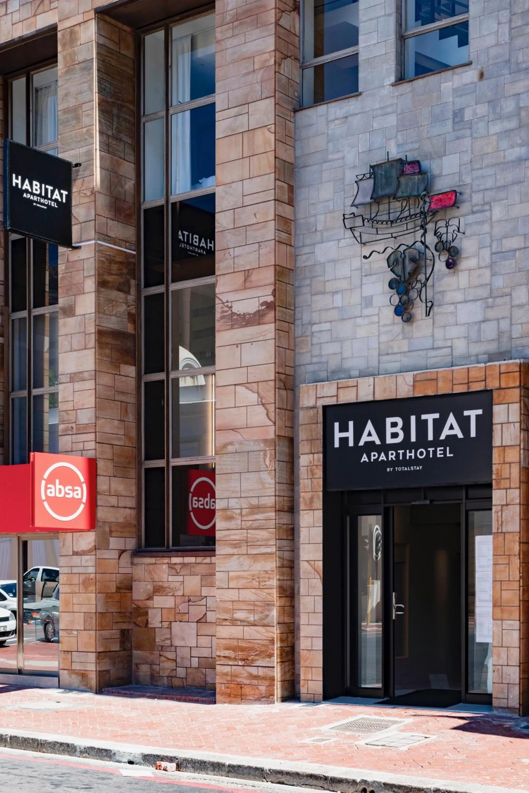 Property logo or sign in Habitat Aparthotel by Totalstay