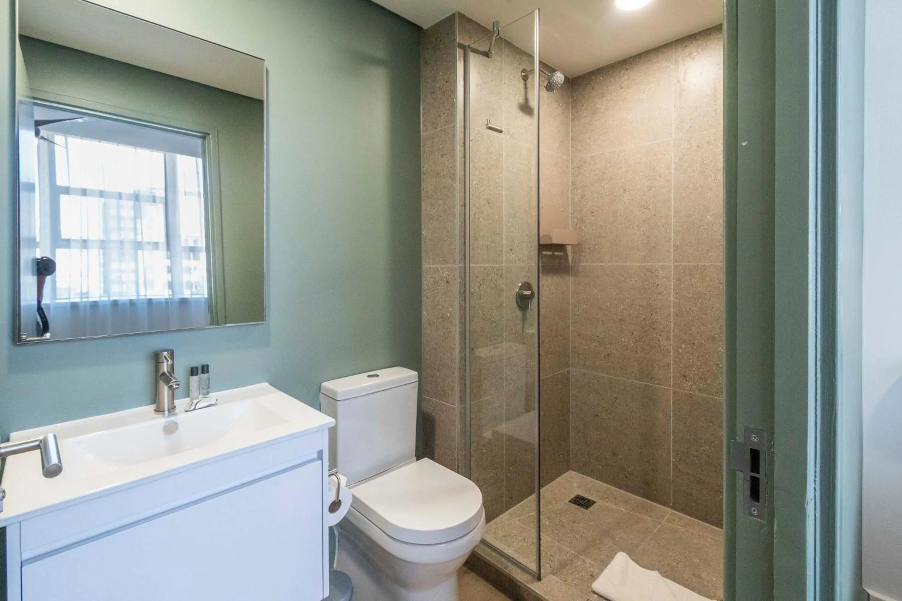 Bathroom in Habitat Aparthotel by Totalstay