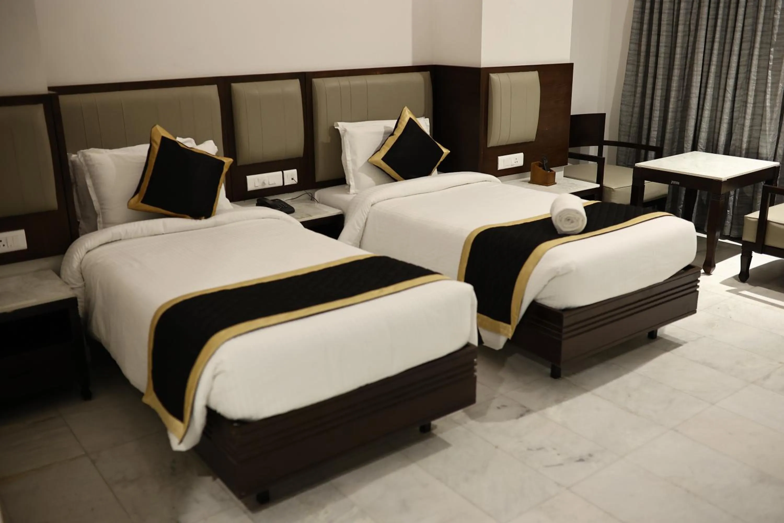 Bed in Hotel Saratharajans