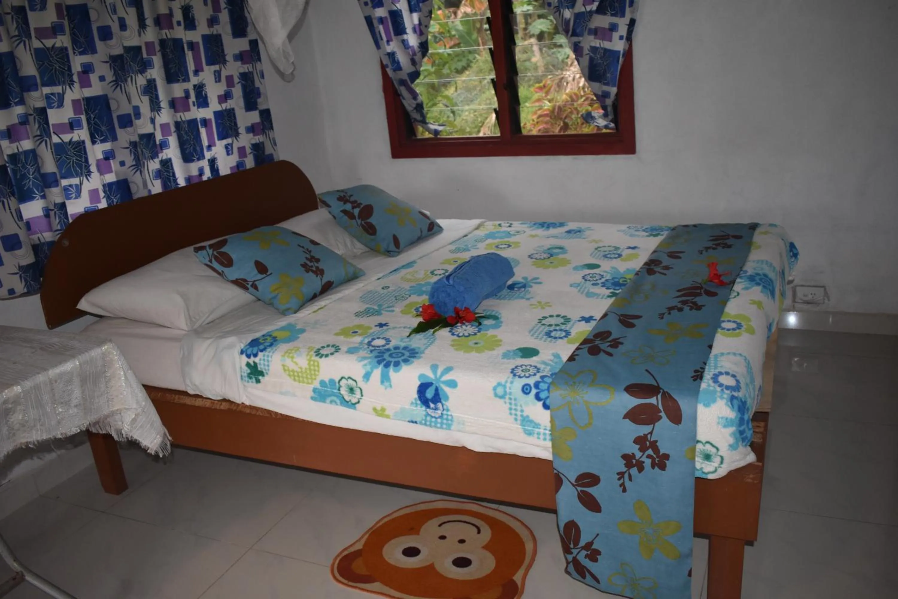 Bed in Alofa Beach Bungalows