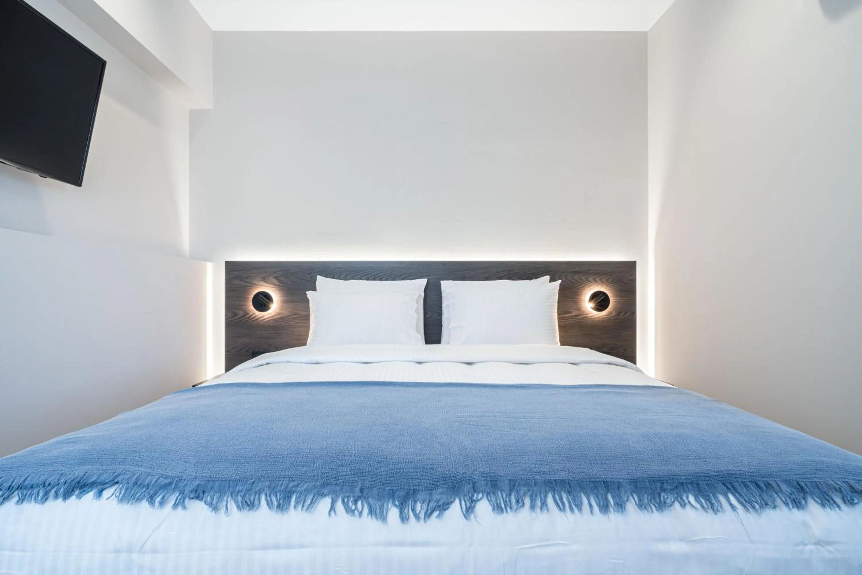 Bed in D Suites & Rooms