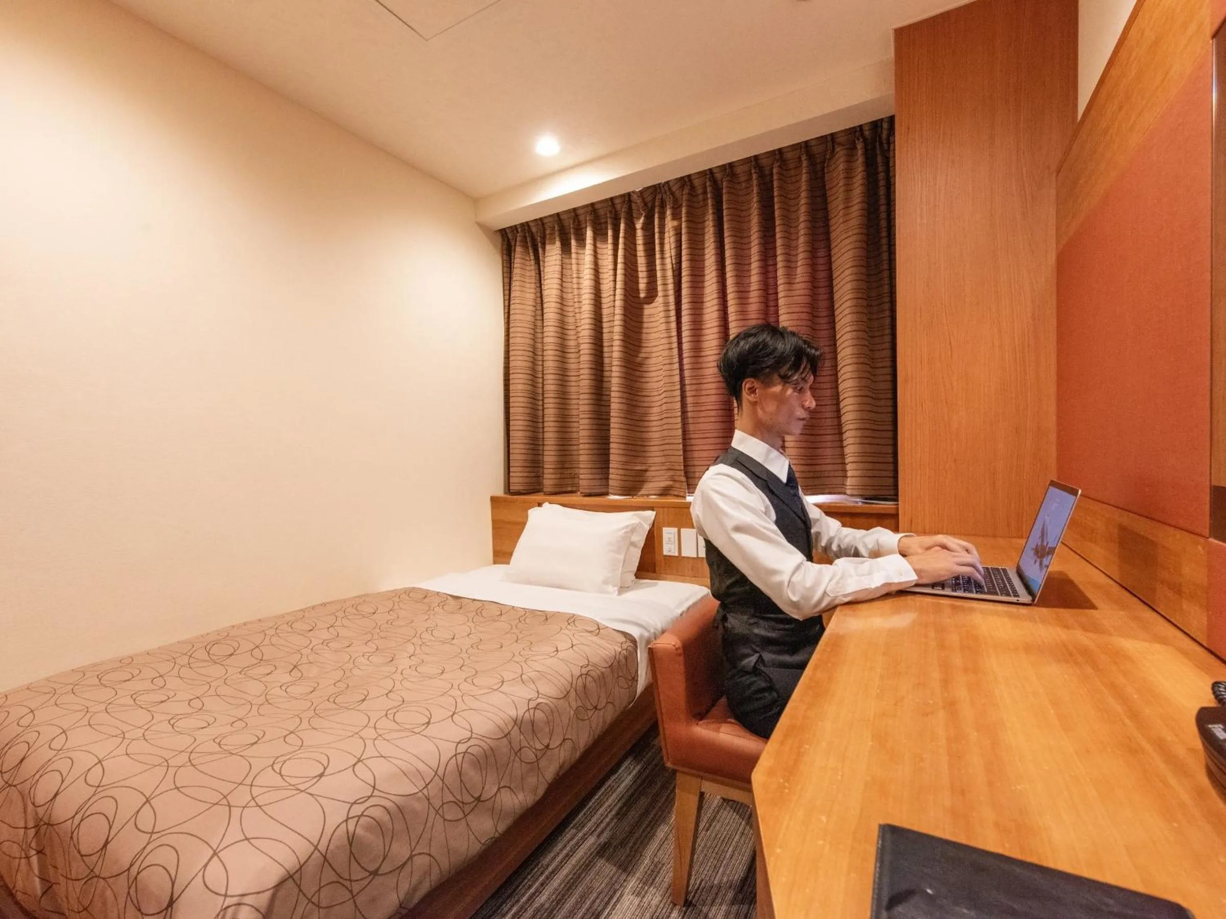 Bed in HOTEL RELIEF Sapporo Susukino