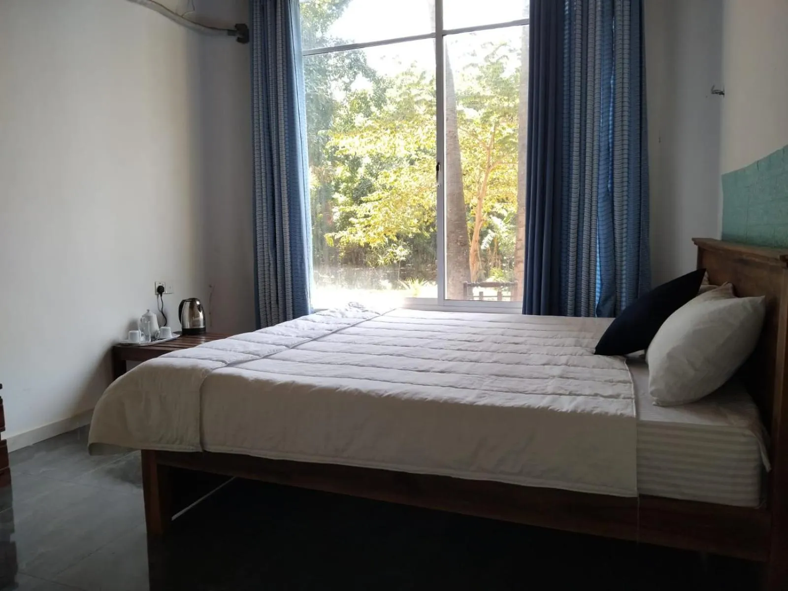 Bed in Esha Beach Resort Rooms