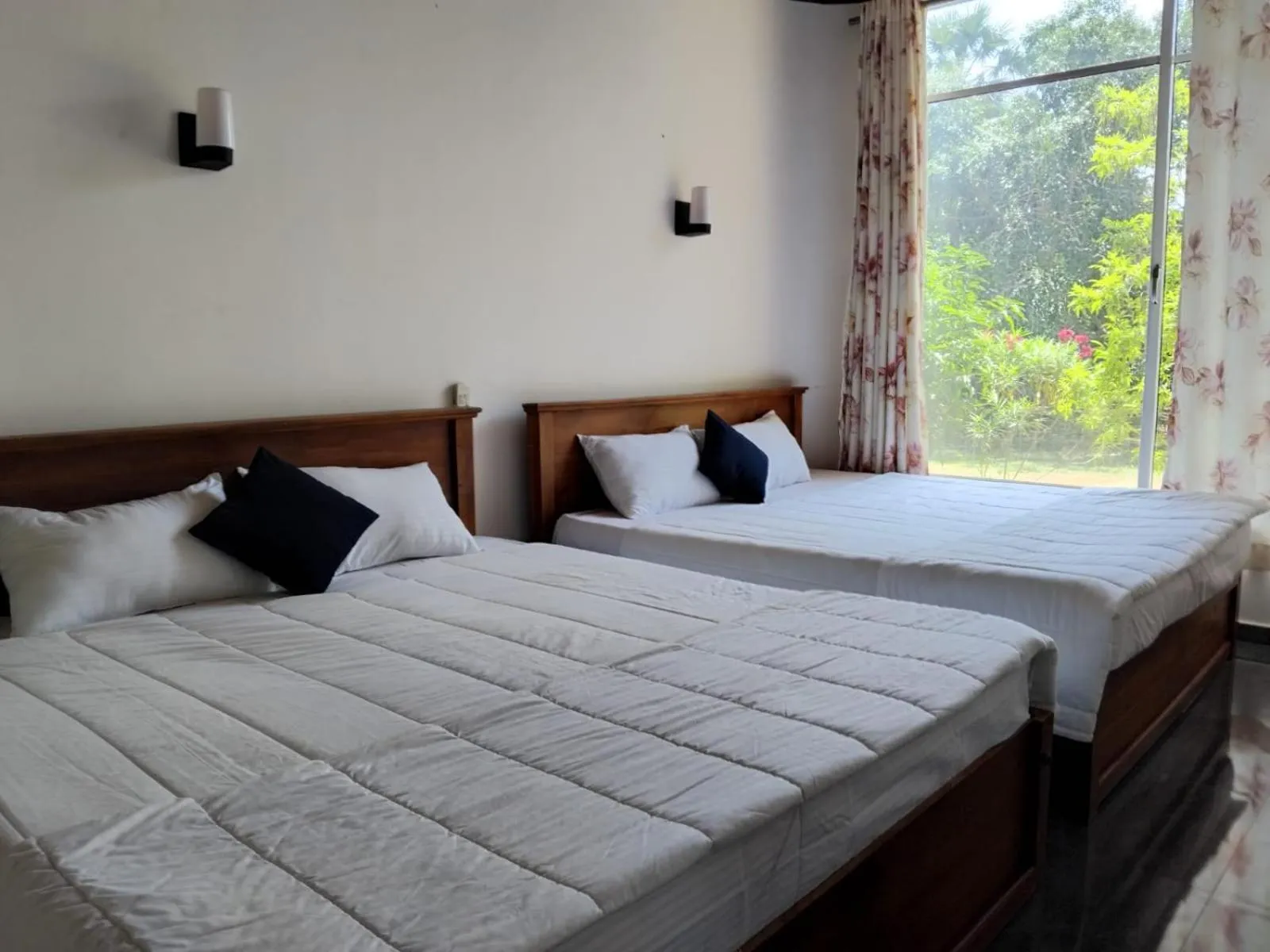 Bed in Esha Beach Resort Rooms