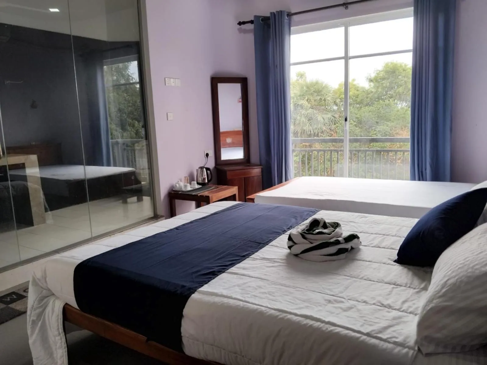 Bed in Esha Beach Resort Rooms