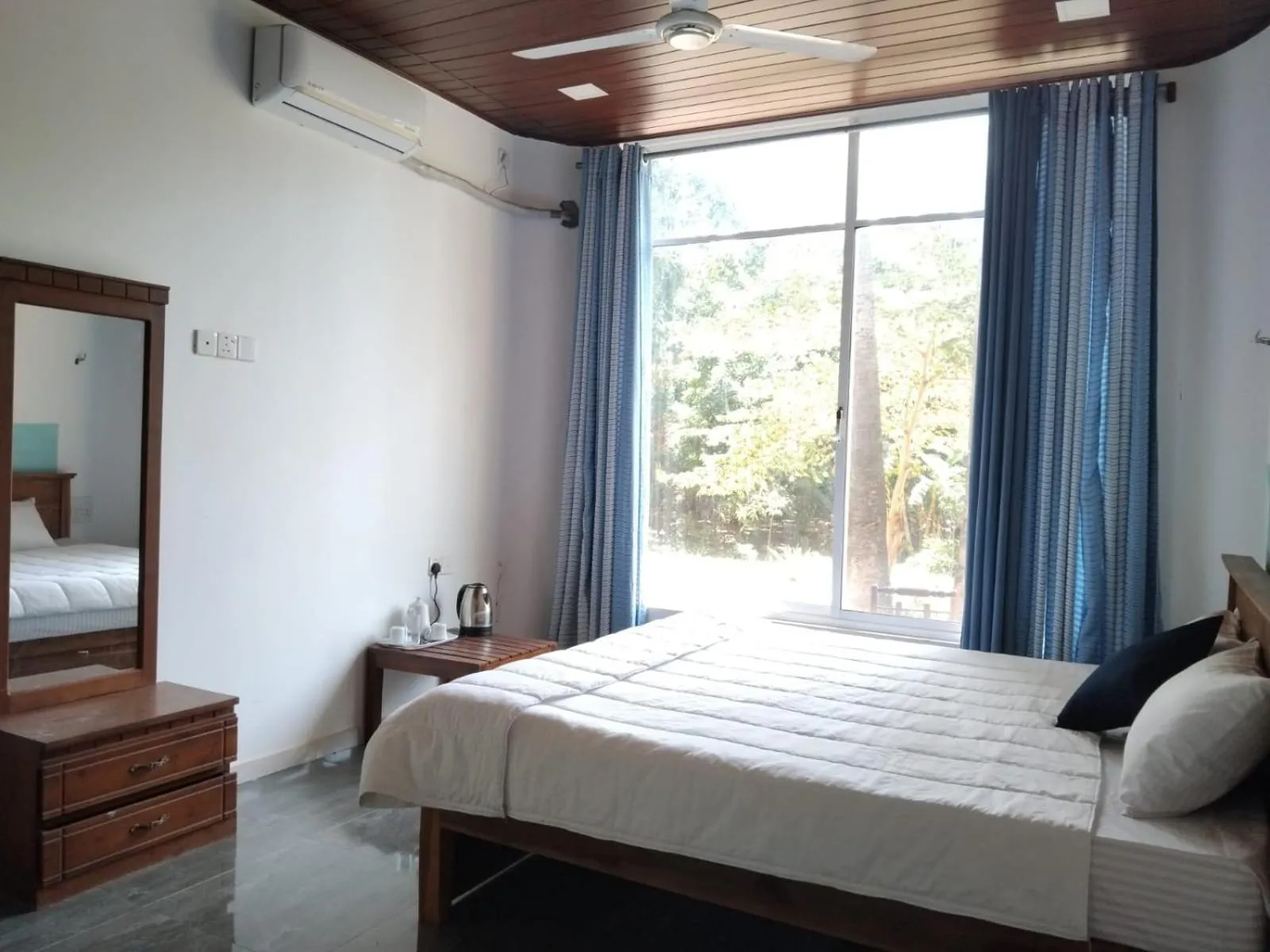 Bed in Esha Beach Resort Rooms
