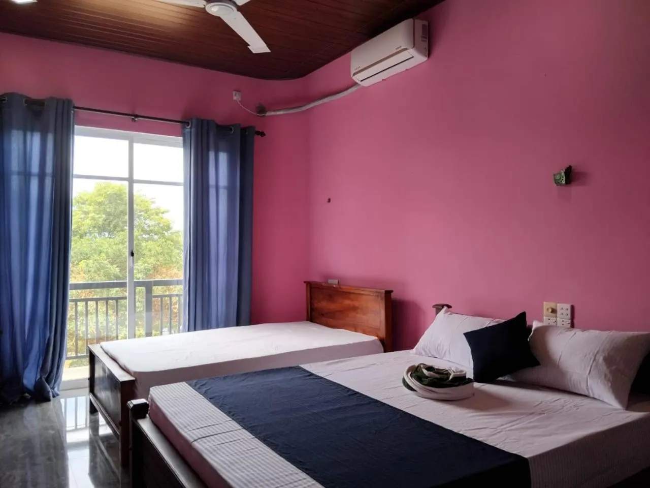 Bed in Esha Beach Resort Rooms