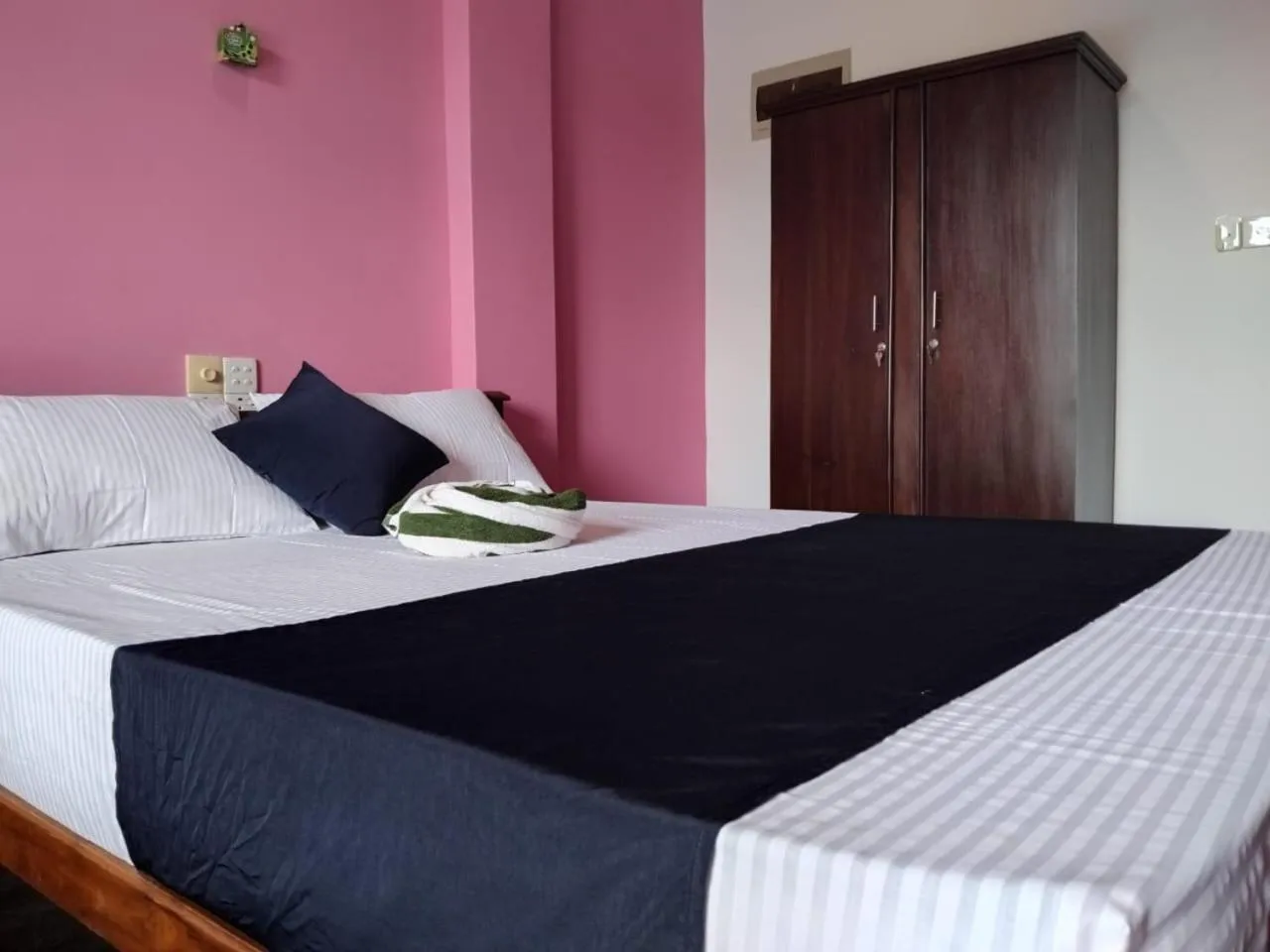 Bed in Esha Beach Resort Rooms