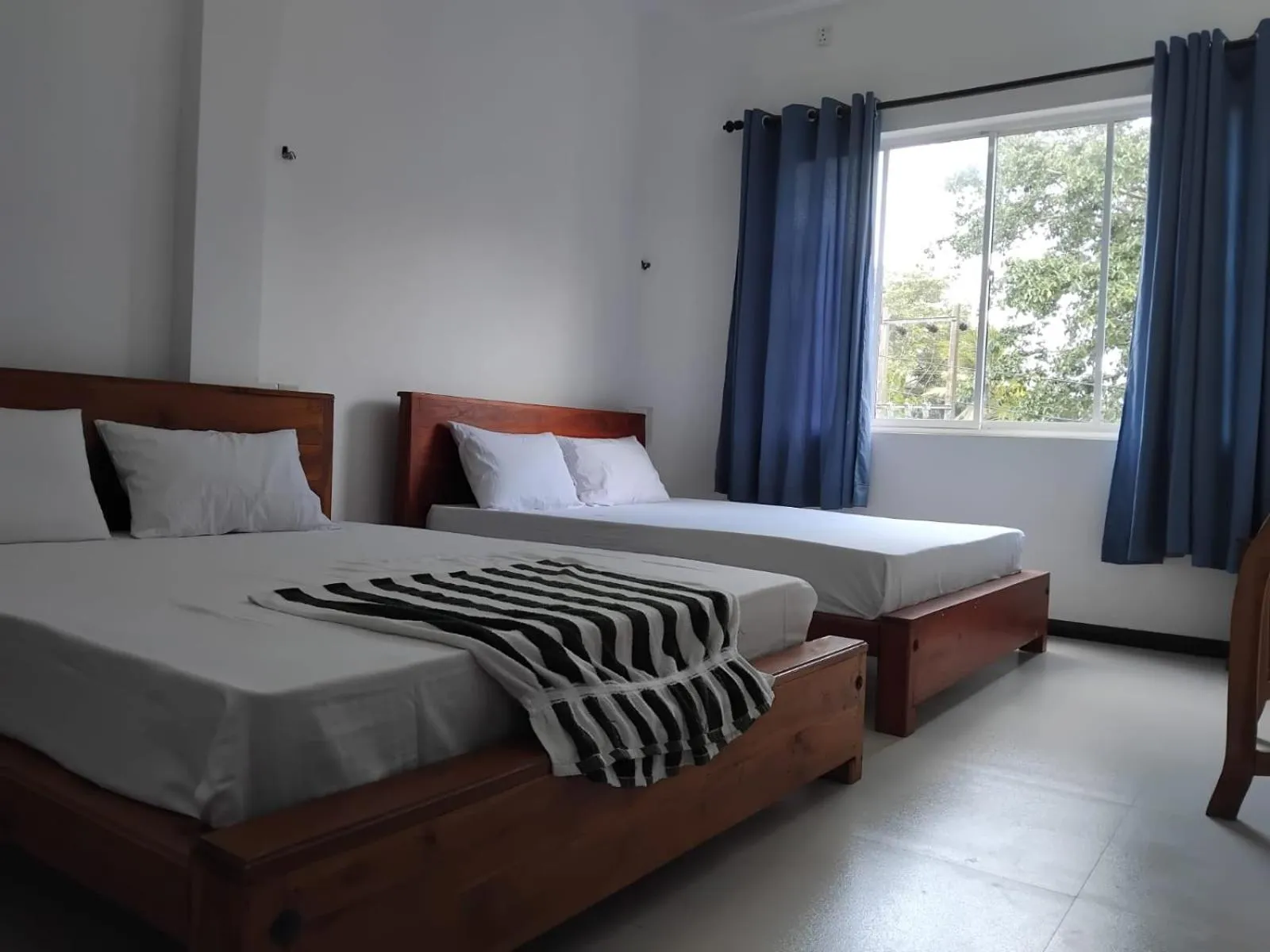 Bed in Esha Beach Resort Rooms