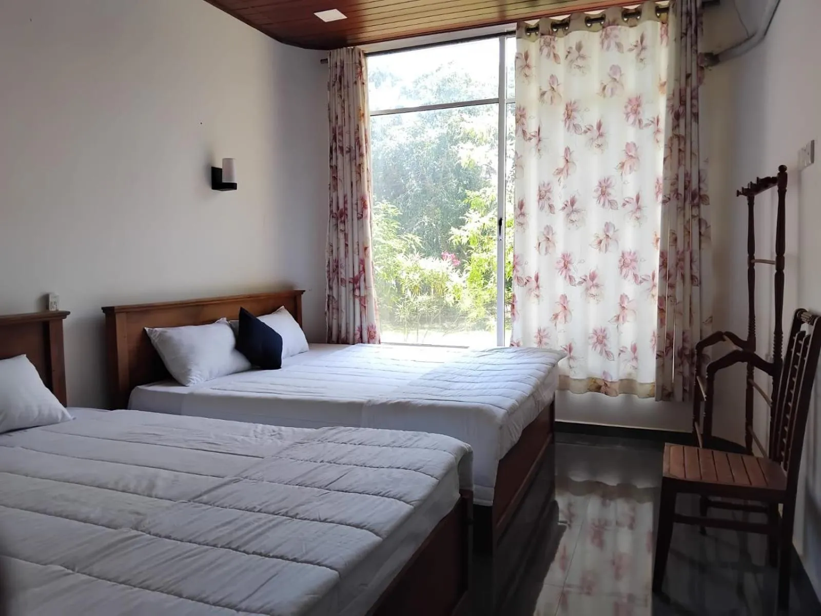 Bed in Esha Beach Resort Rooms