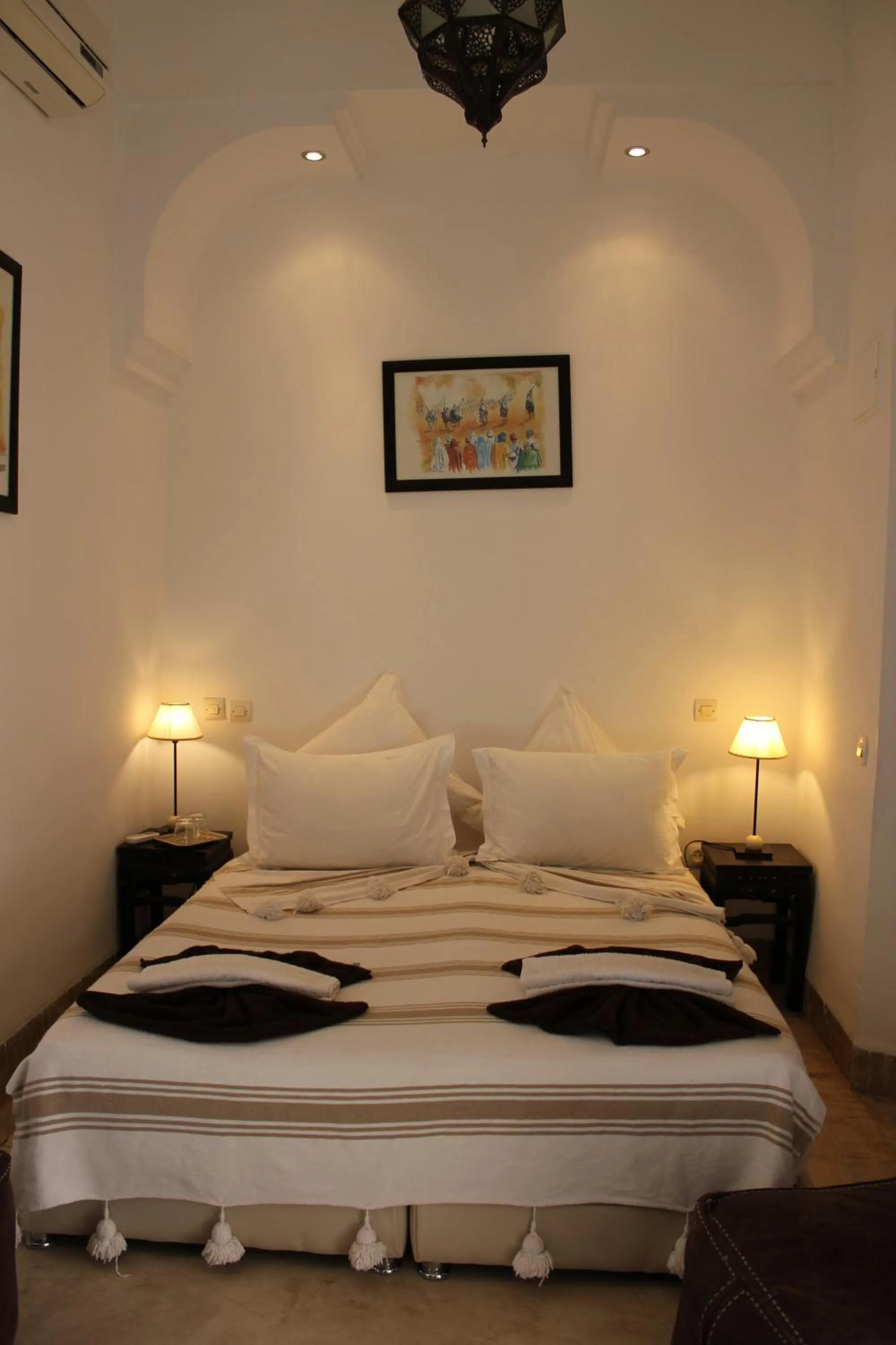 Bed in Riad Jnan El Cadi