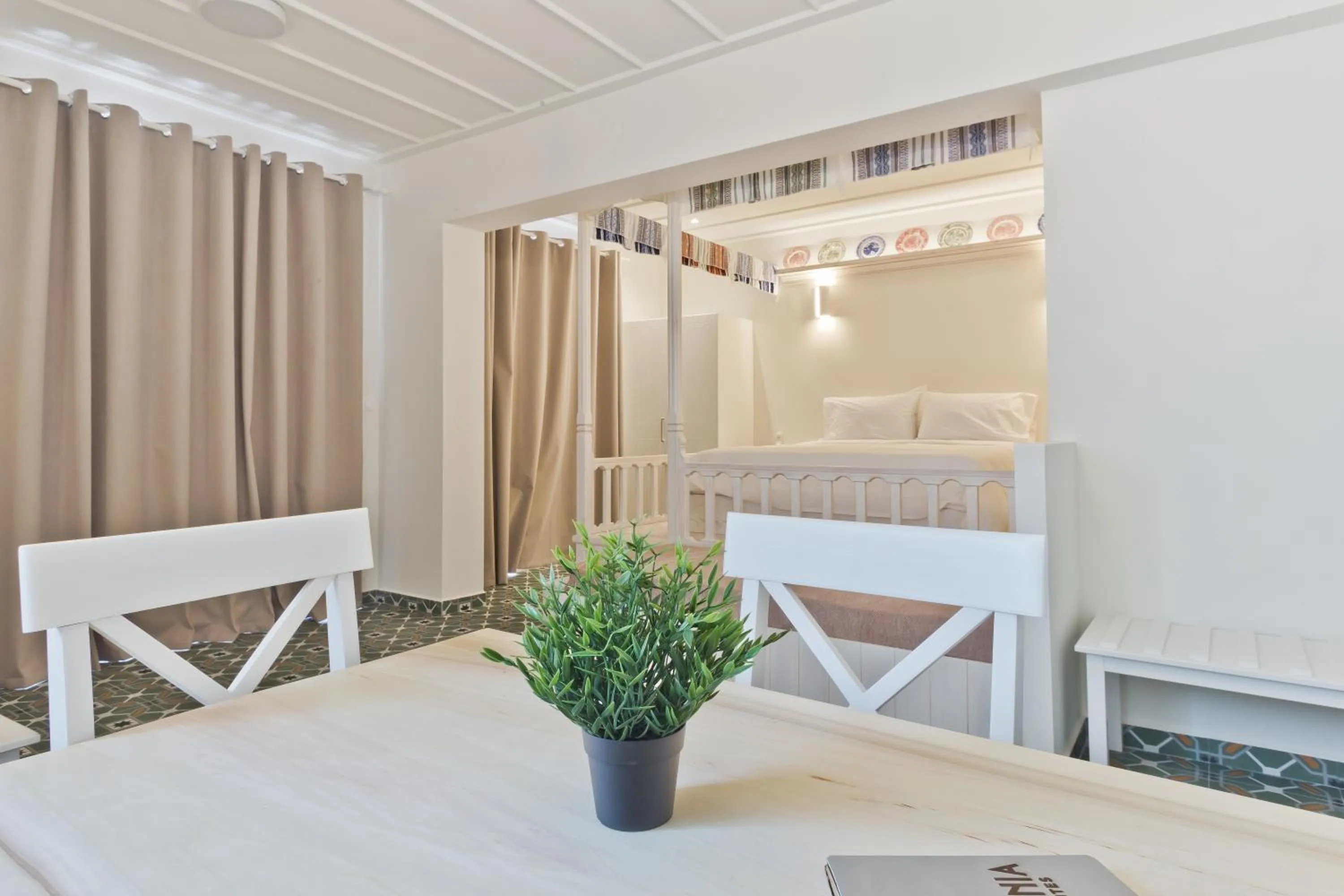 Bed in Posidonia Luxury Suites