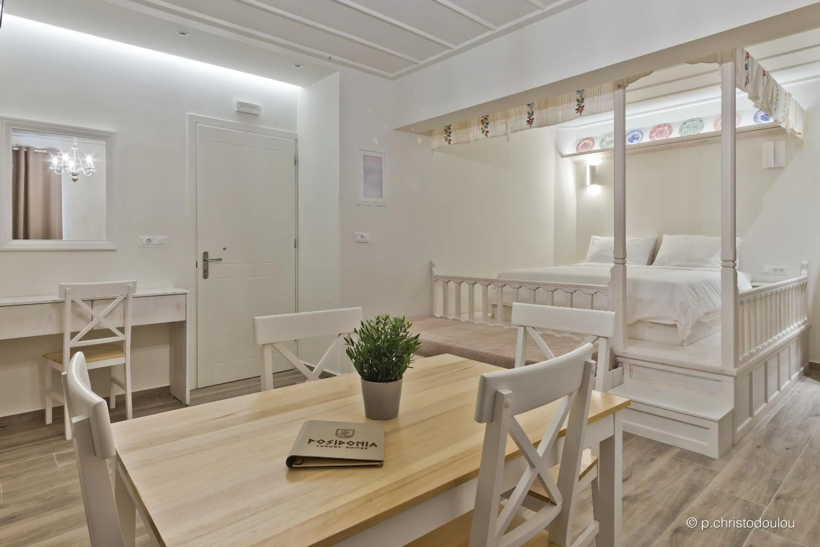 Bed in Posidonia Luxury Suites