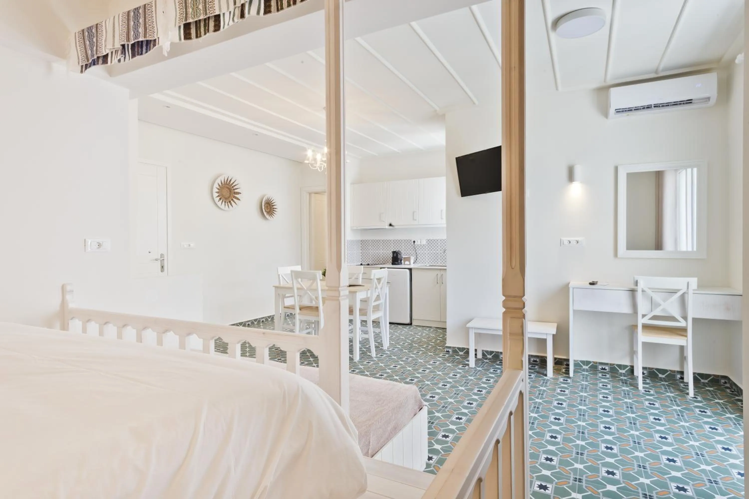 Bed in Posidonia Luxury Suites