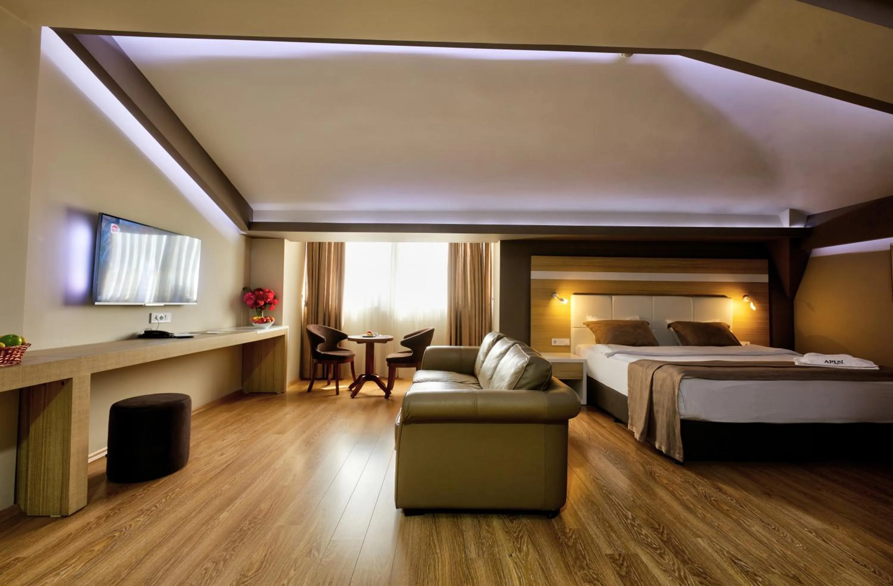 Seating area, Bed in Arus Hotel