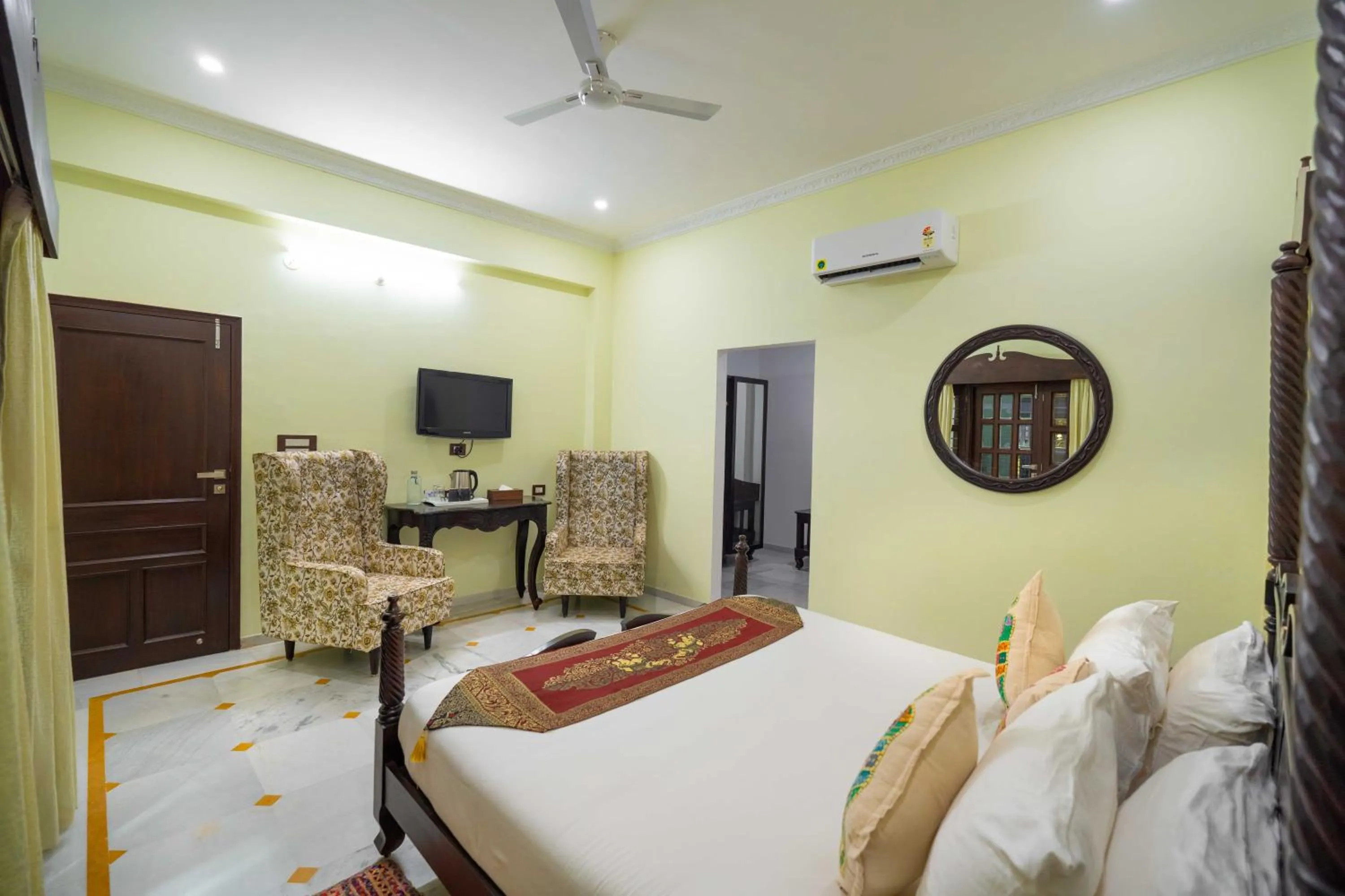 Seating area, Bed in Amaatra Resorts