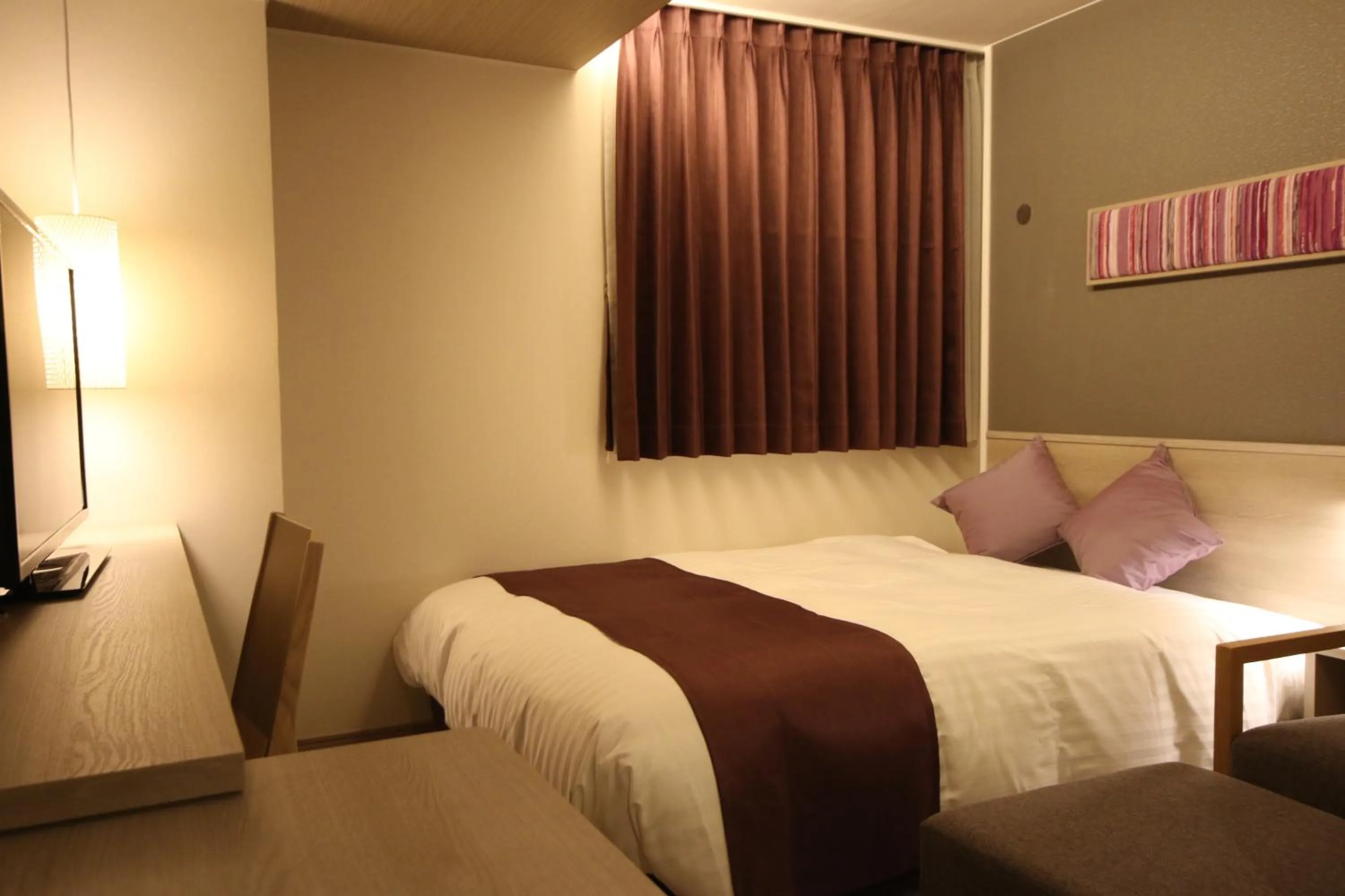 Bed in Kita Hotel