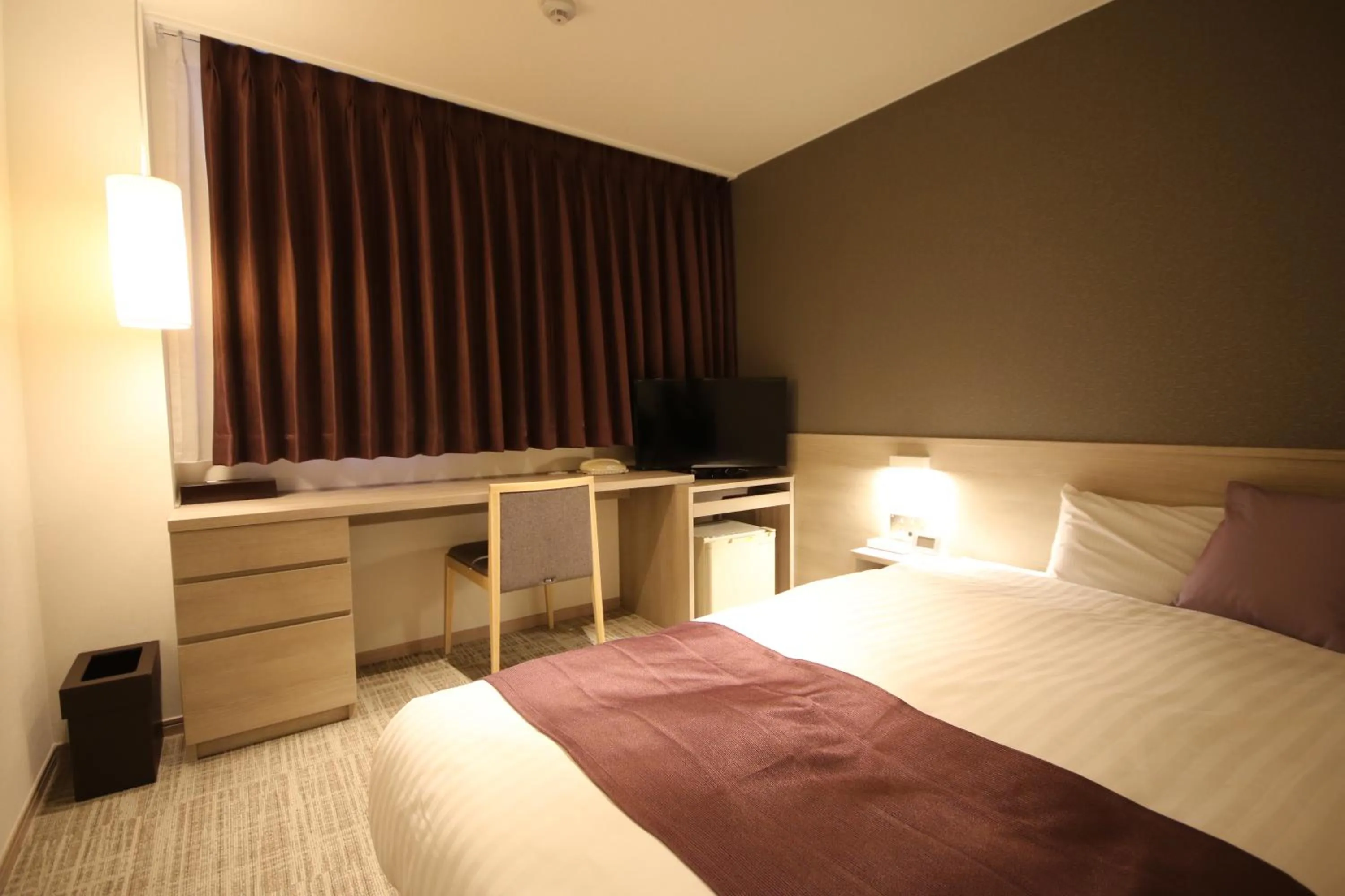Bed in Kita Hotel