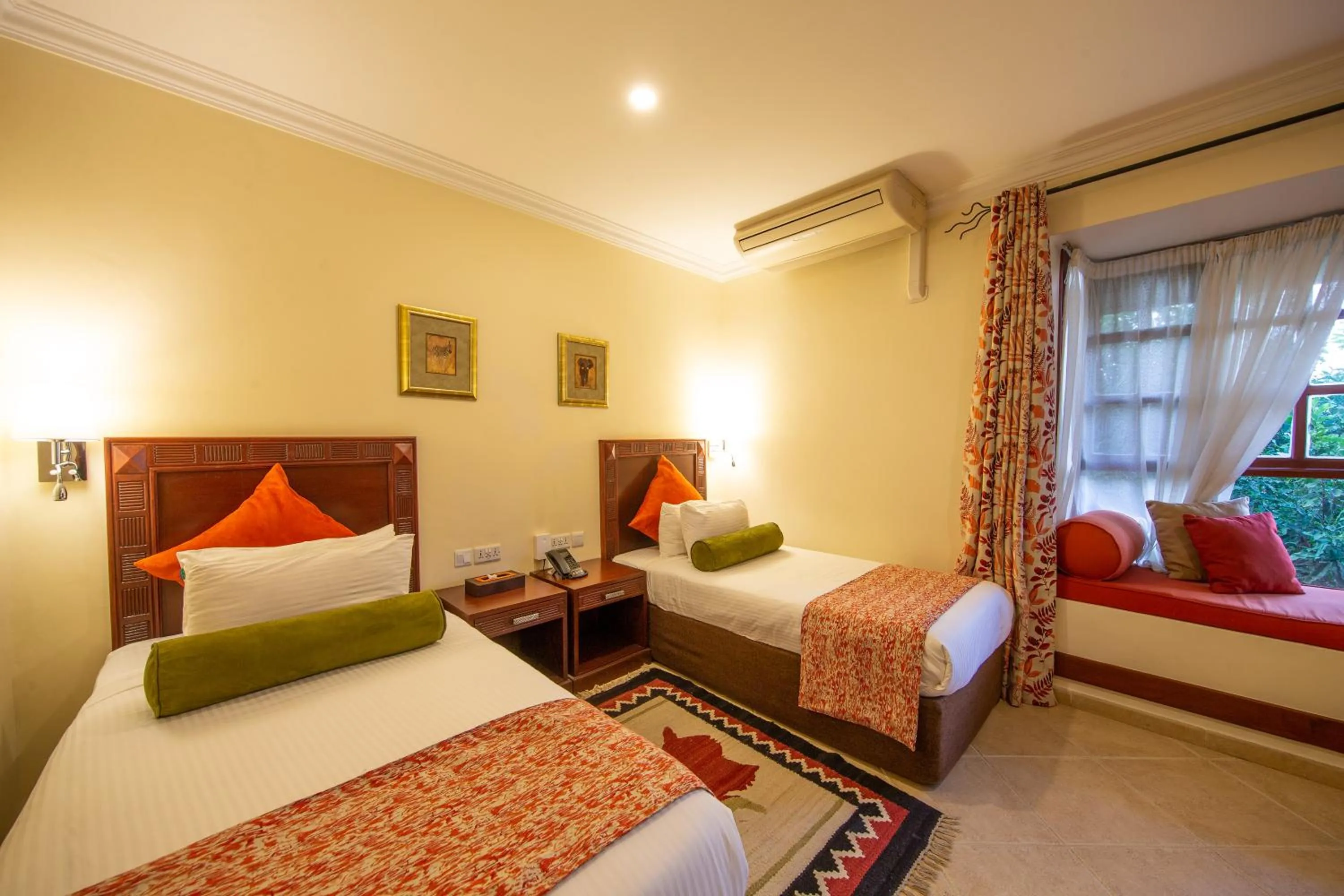 Bed in African Tulip Hotel