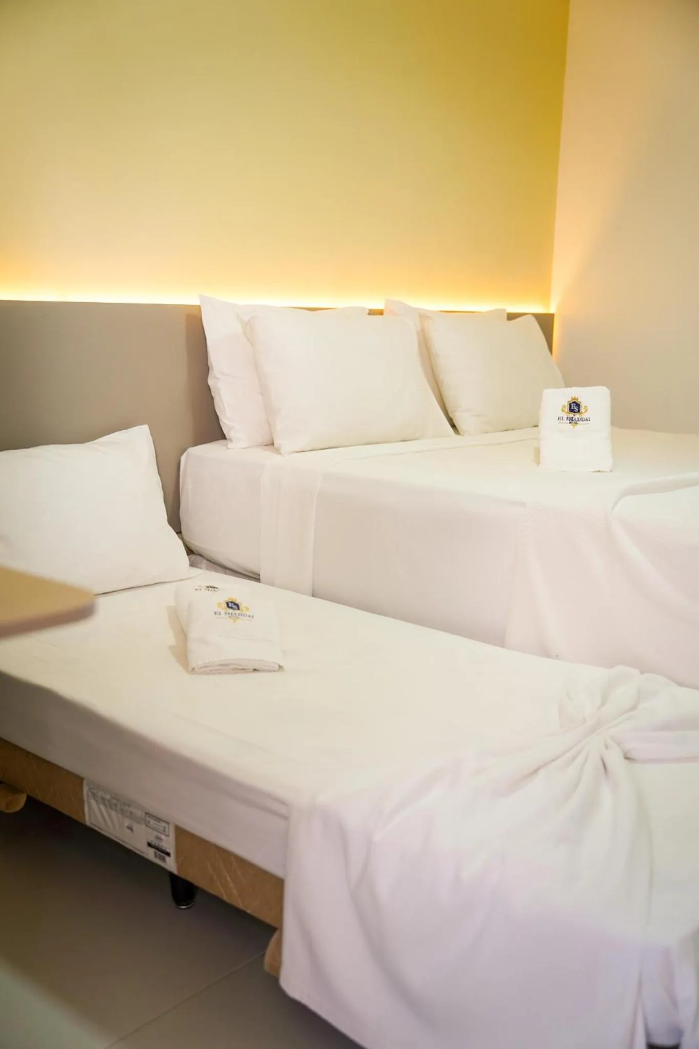 Bed in EL SHADDAI HOTEL