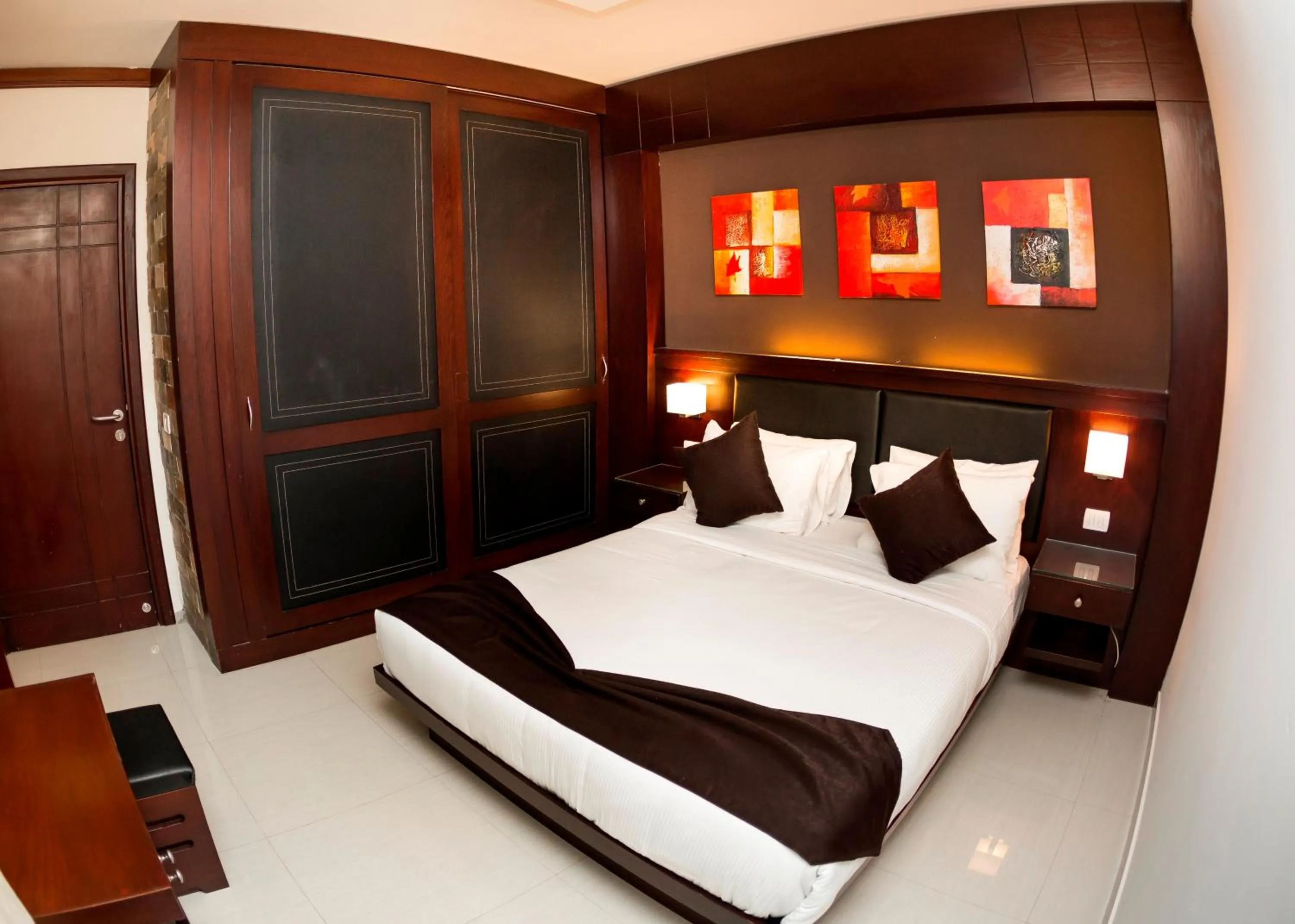 Bed in Panacea Suites Hotel
