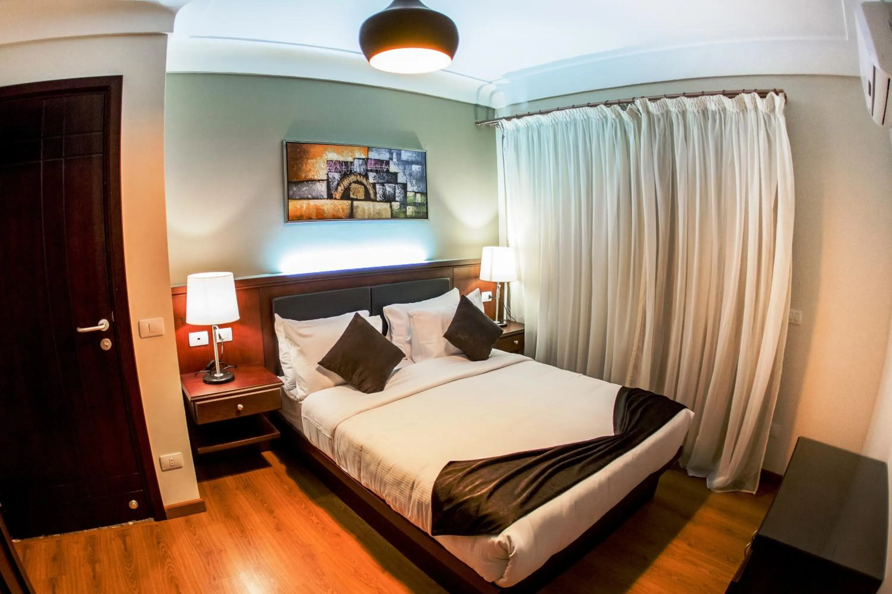 Bedroom, Bed in Panacea Suites Hotel