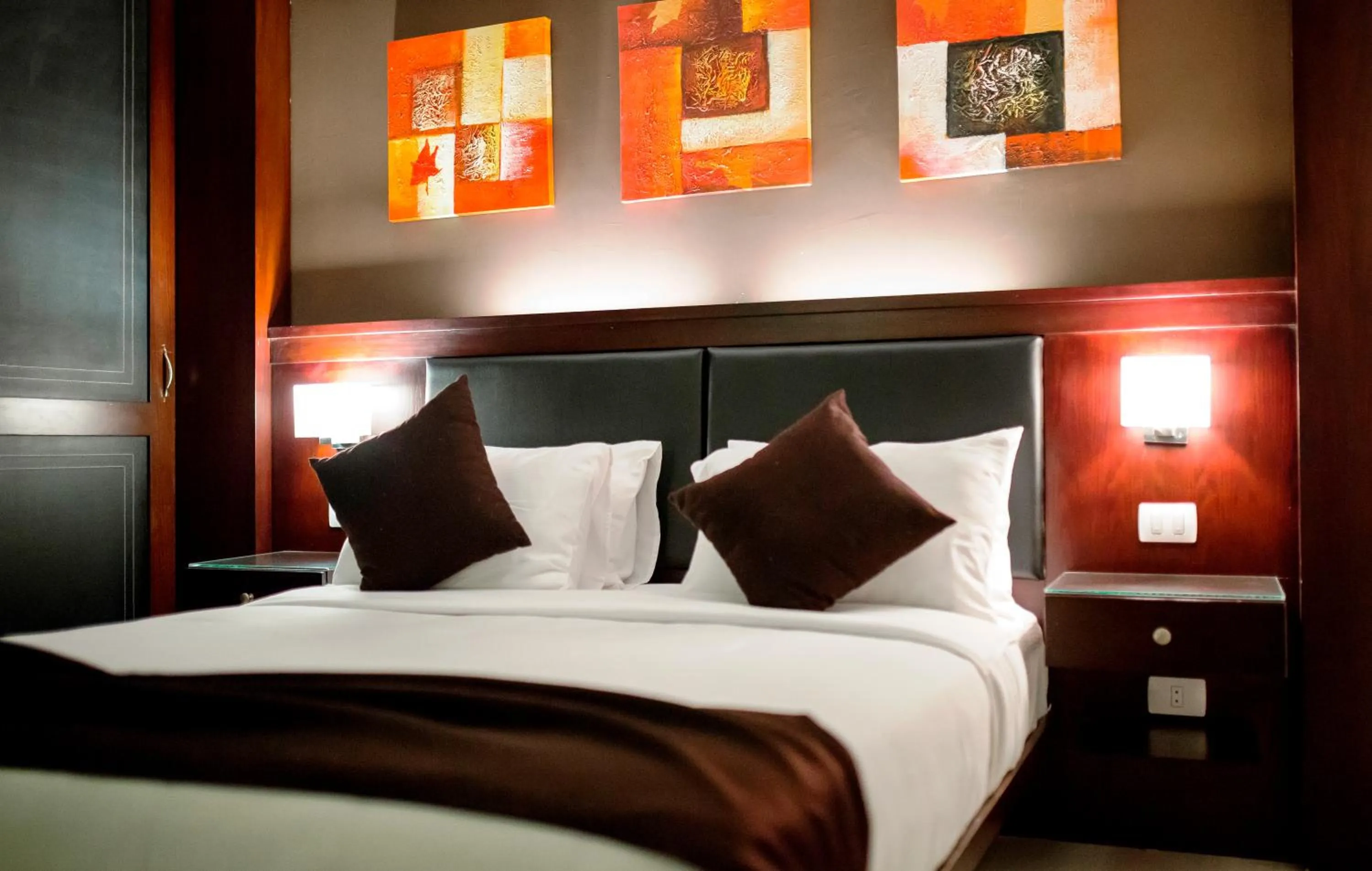 Bed in Panacea Suites Hotel