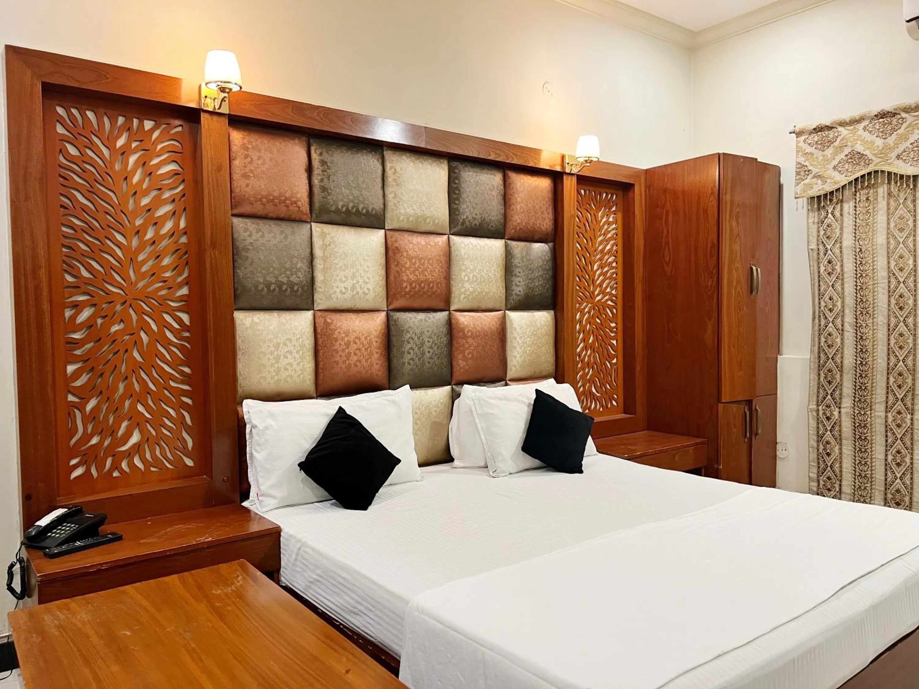 Bed in The Grand Hotel Multan